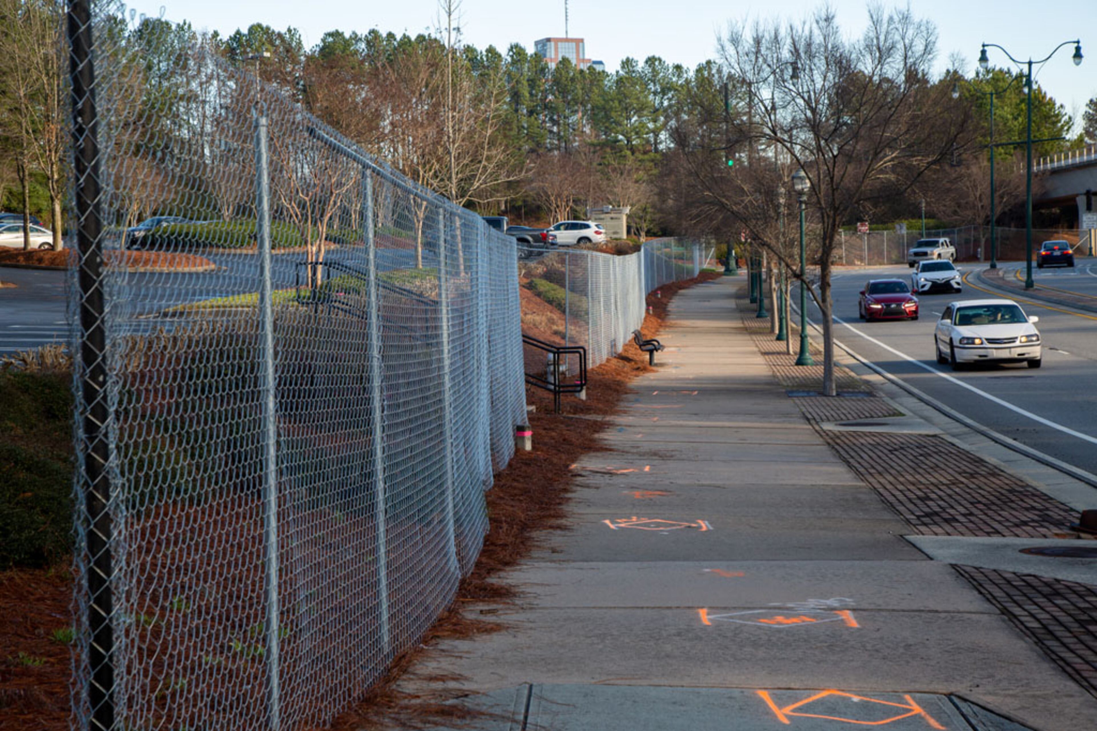 Fencing along Perimeter Center Parkway NE in Dunwoody is the beginning of the High Street project. The idea for High Street proposed in Dunwoody has languished for more than 10 years, but construction is finally expected to start this year. The Boston-based developers recently got the required special land use and land disturbance permits from the city as the plans for High Street come into view a little more. They also got a tax break from the city's development authority. They hope for it to be like Avalon and the Battery - a retail, entertainment and office hub that would create a true "downtown" for the Perimeter Center area.. (Photo by Phil Skinner)