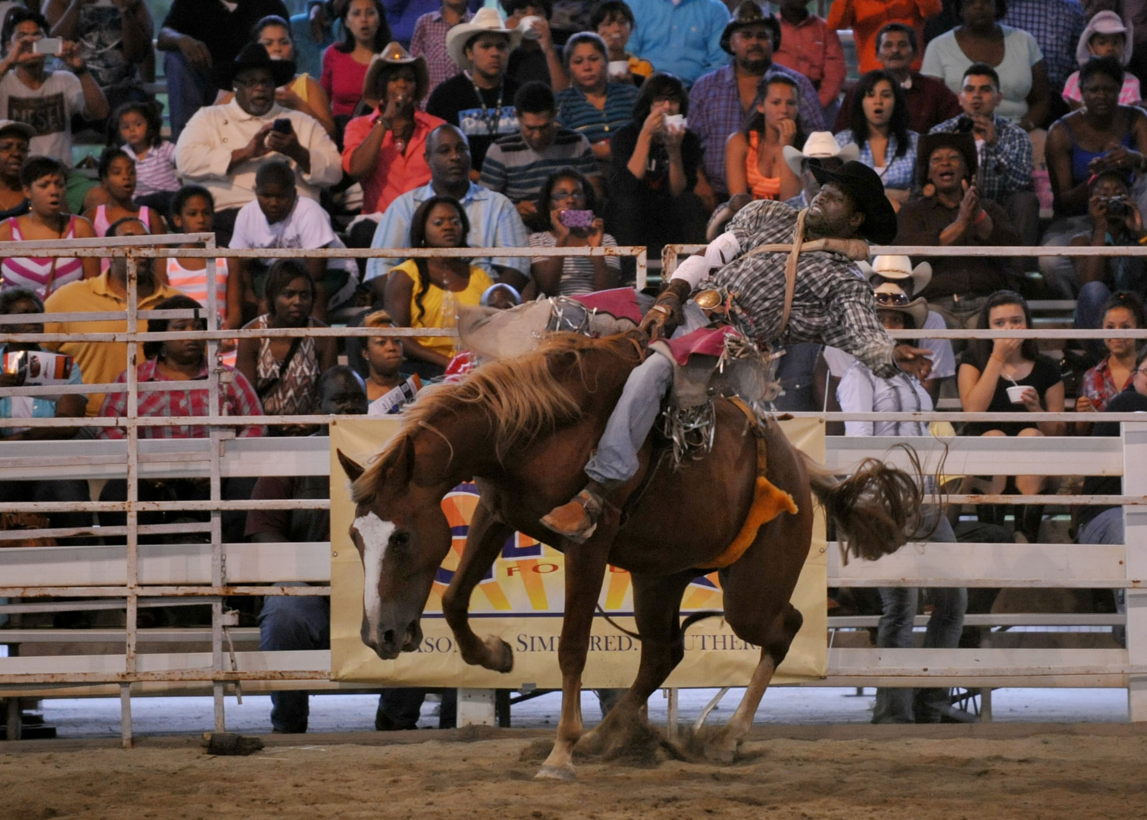 Jason Griffin of Dallas, Texas, participates in the Bareback Ridin' event.