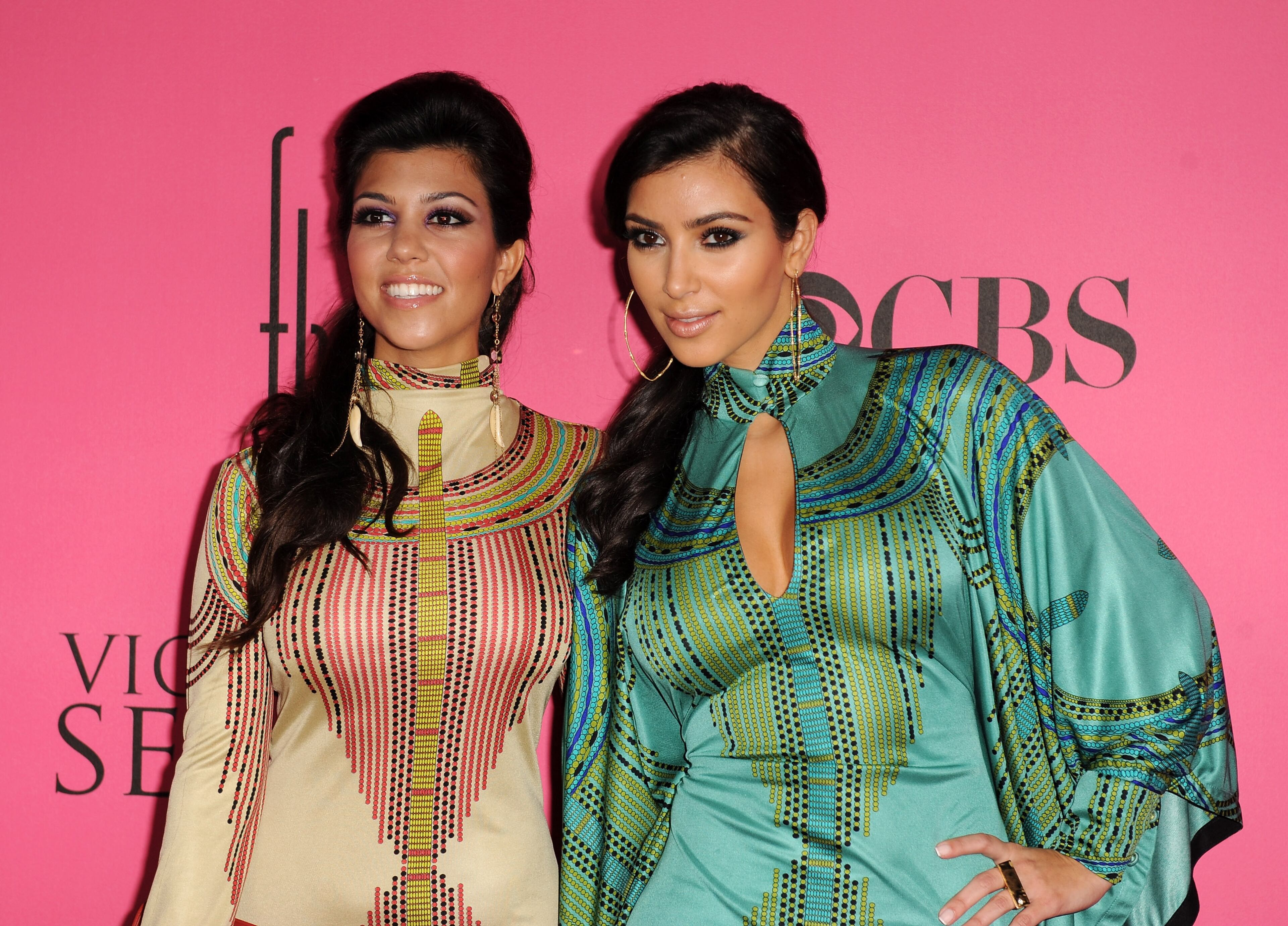 Kourtney Kardashian and Kim Kardashian attend the 2008 Victoria's Secret Fashion Show at the Fontainebleau on November 15, 2008 in Miami Beach, Florida. (Photo by Gustavo Caballero/Getty Images)