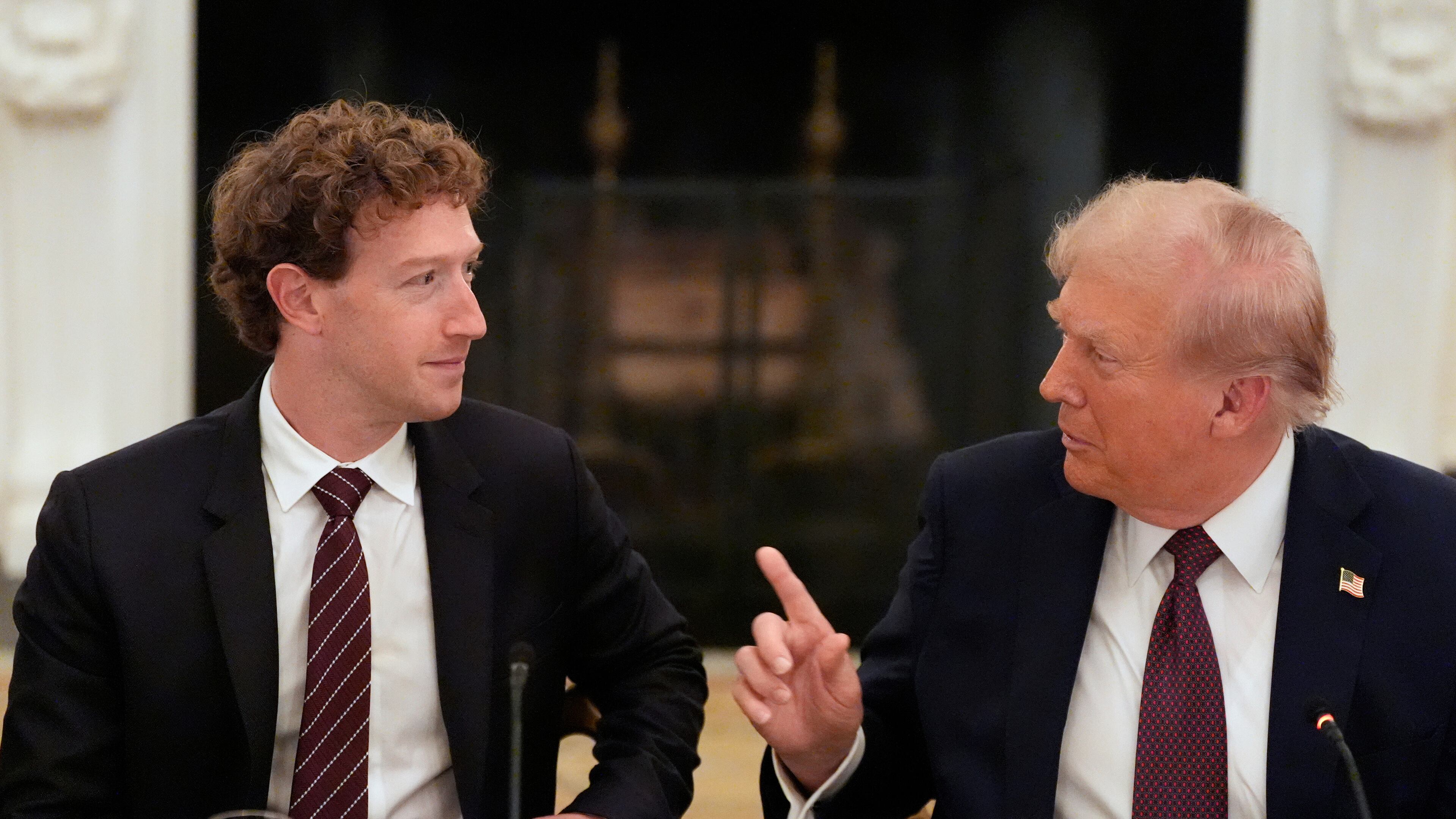 FILE - President Donald Trump speaks to Facebook CEO Mark Zuckerberg during a dinner in the State Dining Room of the White House, Sept. 4, 2025, in Washington. (AP Photo/Alex Brandon, File)