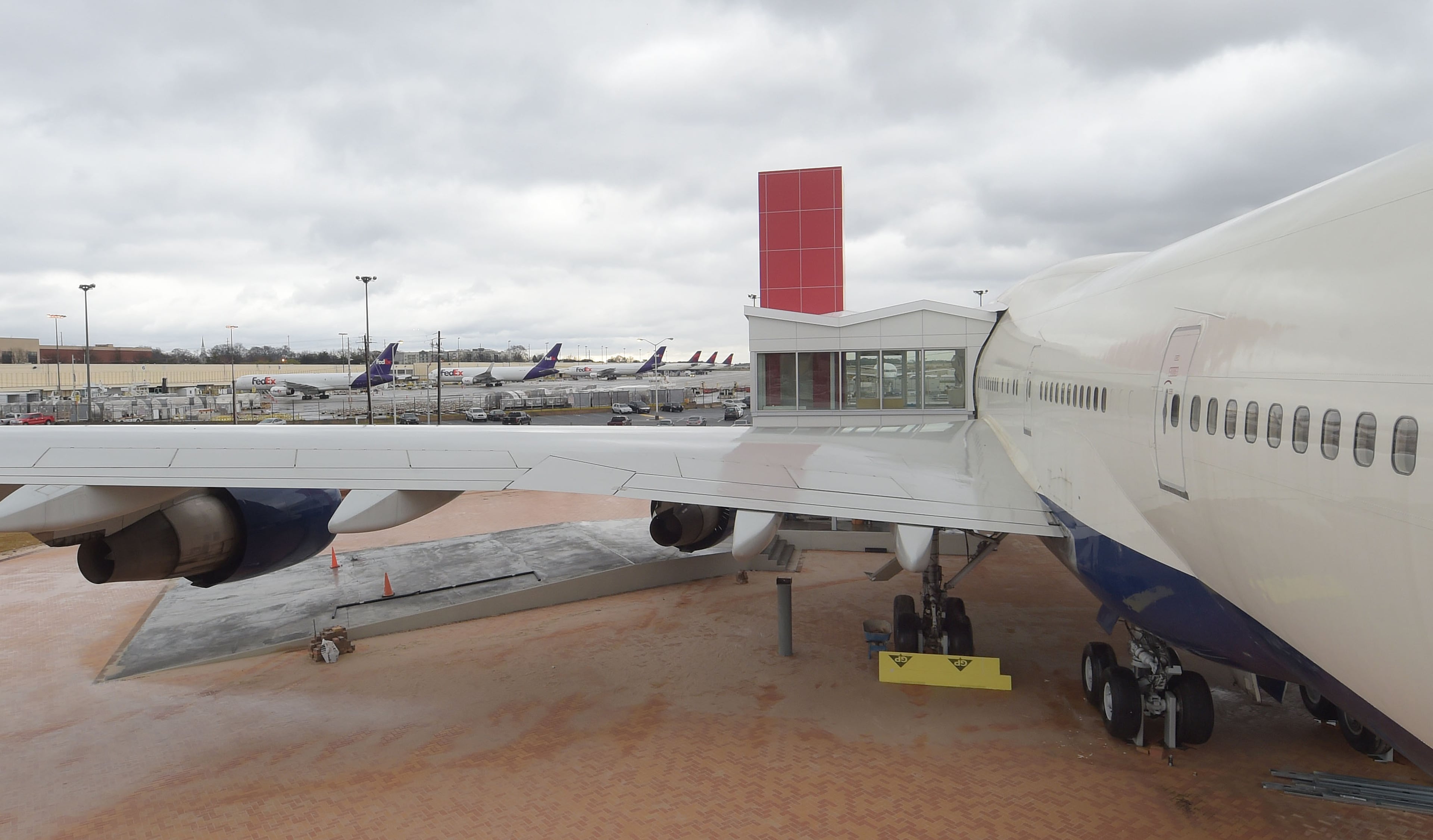 MARCH 14, 2017 ATLANTA The landing gear no longer supports the Boeing 747-400, but is attached to concrete pilings which hold the wheels clear of the ground. The plane is shown during a preview of Delta's 747 Experience Tuesday, March 14, 2017. The exhibit opens soon at the Delta museum. Museum officials explain the genesis of the exhibit and what is unique about the 747 jumbo jet, which Delta retires from its fleet later this year. Kent D. Johnson/AJC