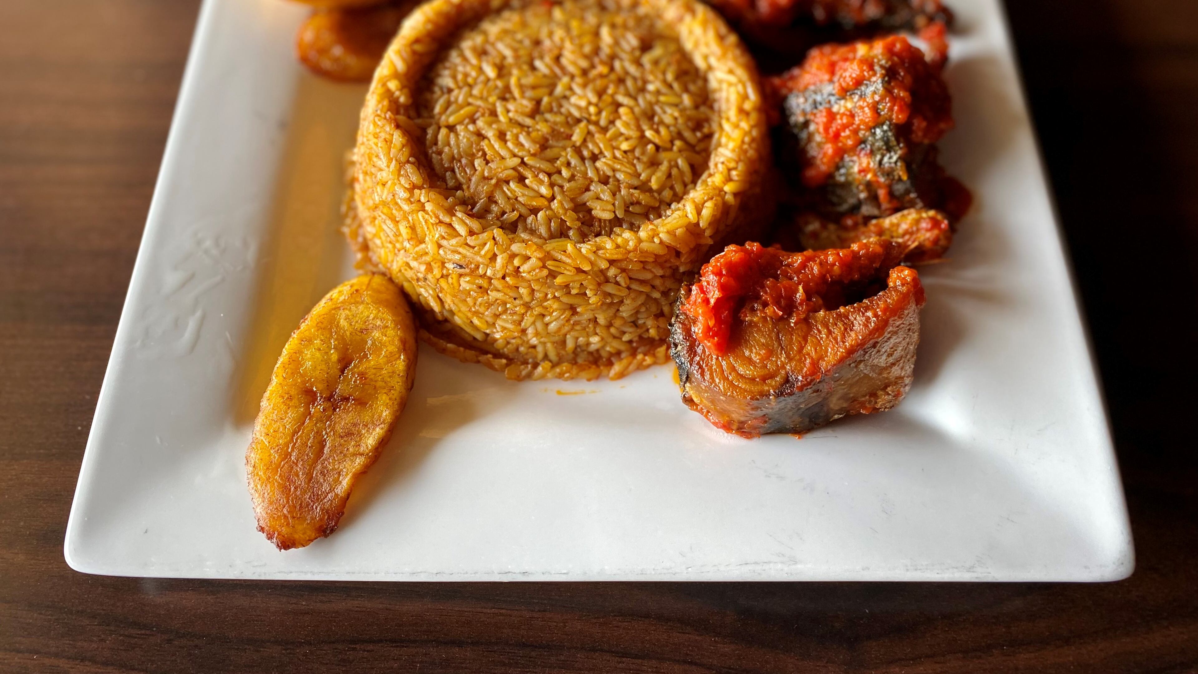 The Island Grill’s jollof rice comes with plantains and a choice of protein — in this case the fried mackerel.
Wendell Brock for The Atlanta Journal-Constitution