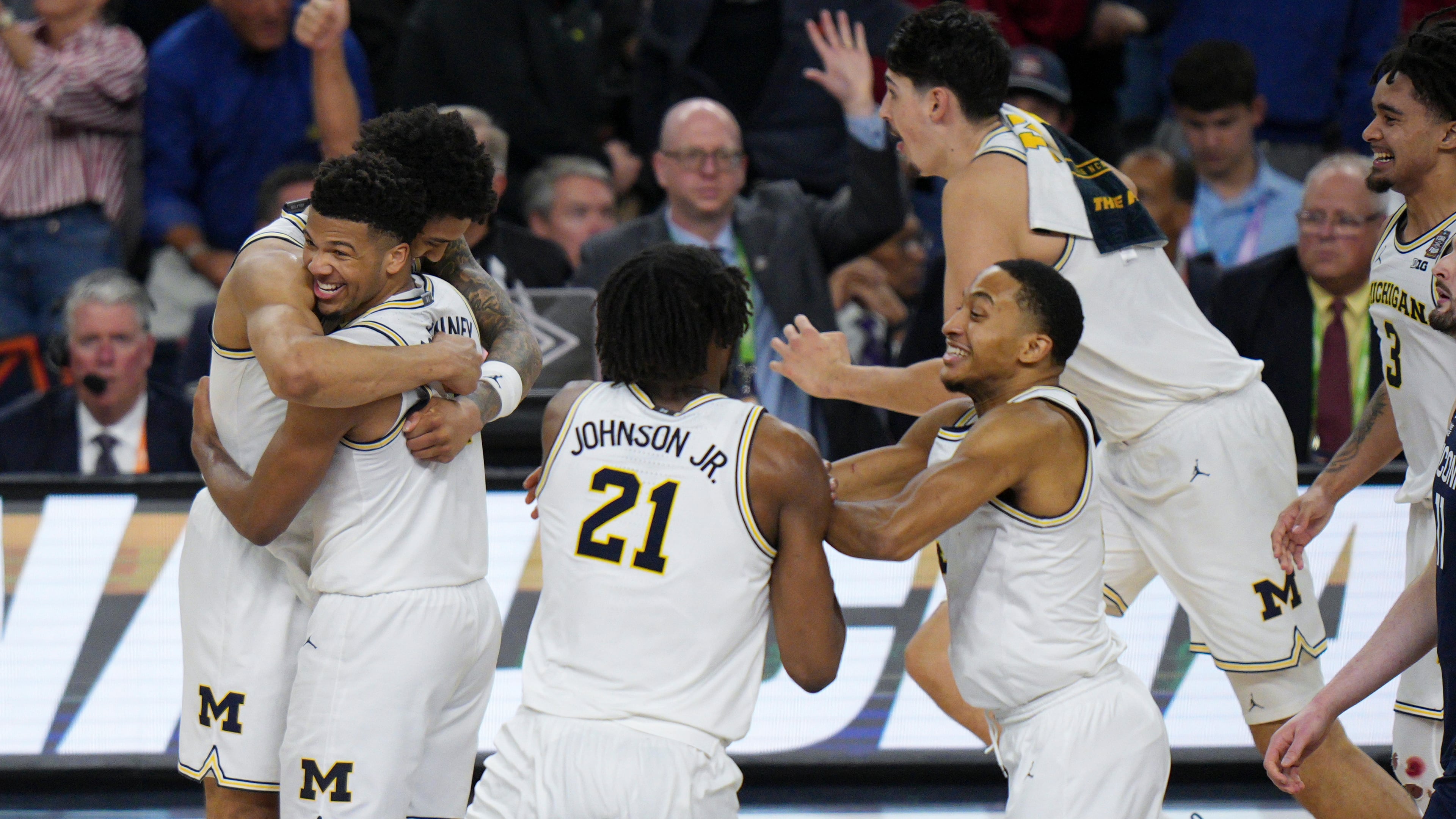 Michigan celebrates after defeating UConn in the NCAA college basketball tournament national championship game at the Final Four, Monday, April 6, 2026, in Indianapolis. (AP Photo/AJ Mast)