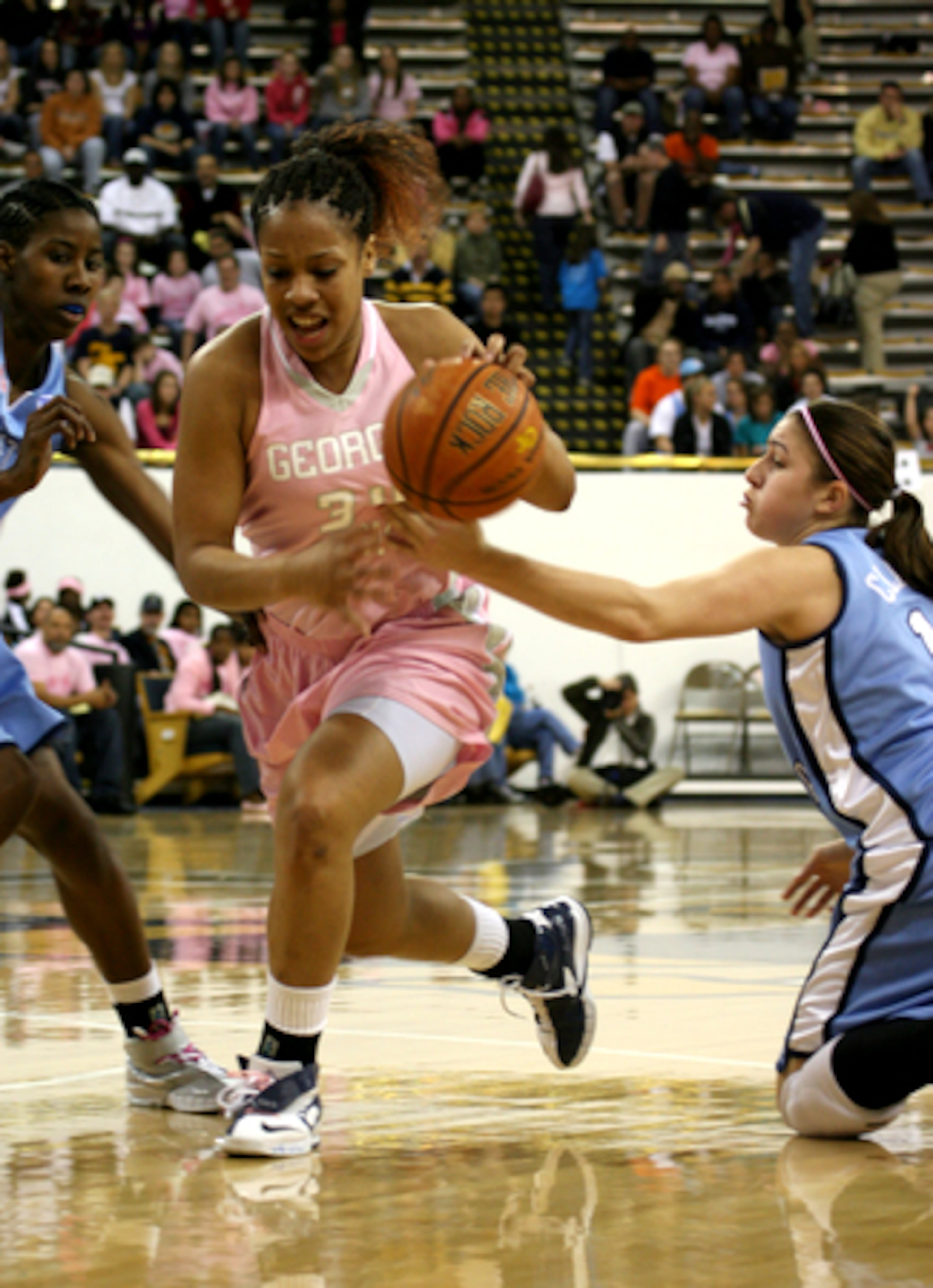 Tech's Iasia Hemingway (left) tries to dribble past Heather Claytor.