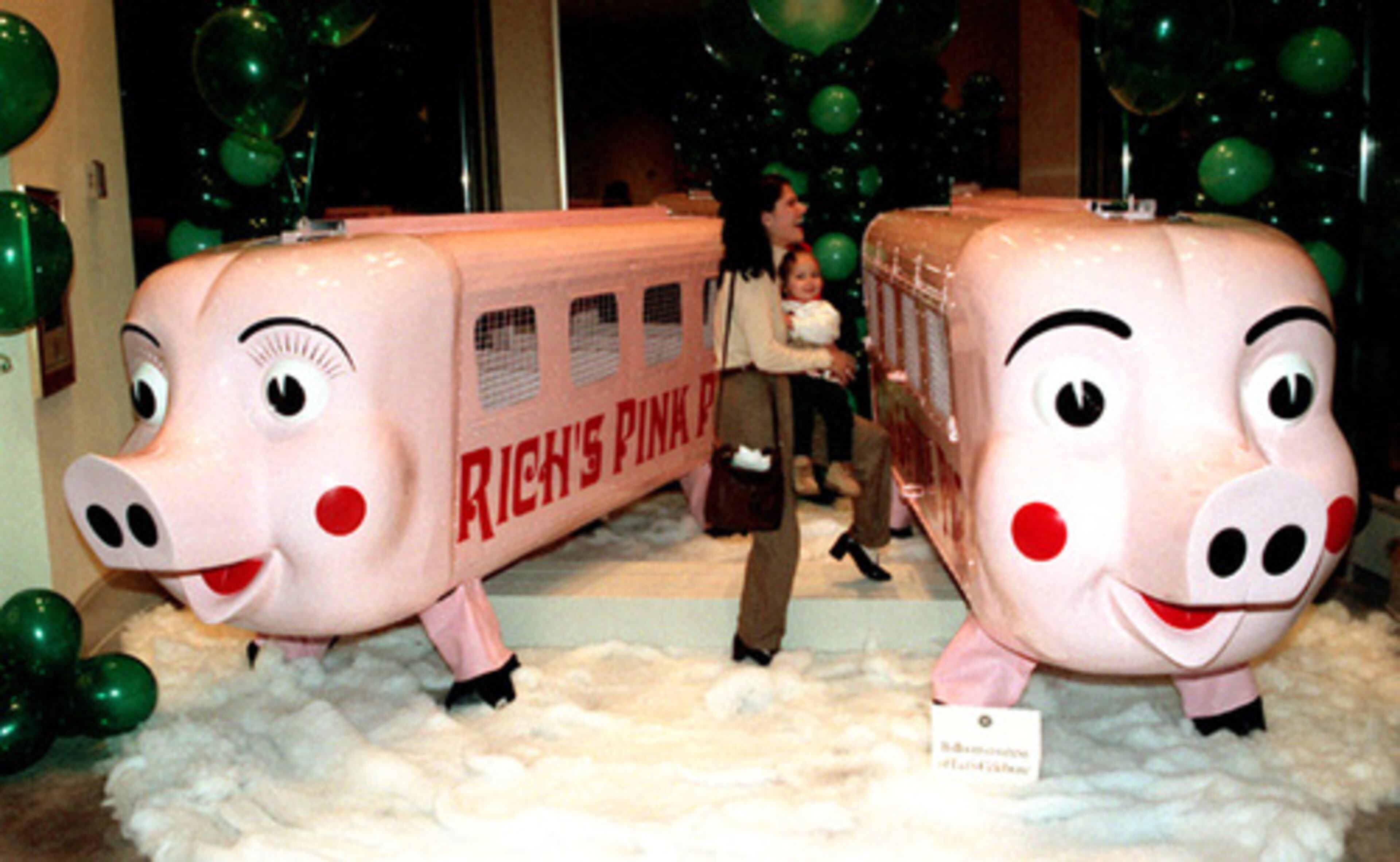 Pink Pigs Pricilla (left) and Percival hung out at the Atlanta History Center during the Annual Candlelight Tour in 1997.