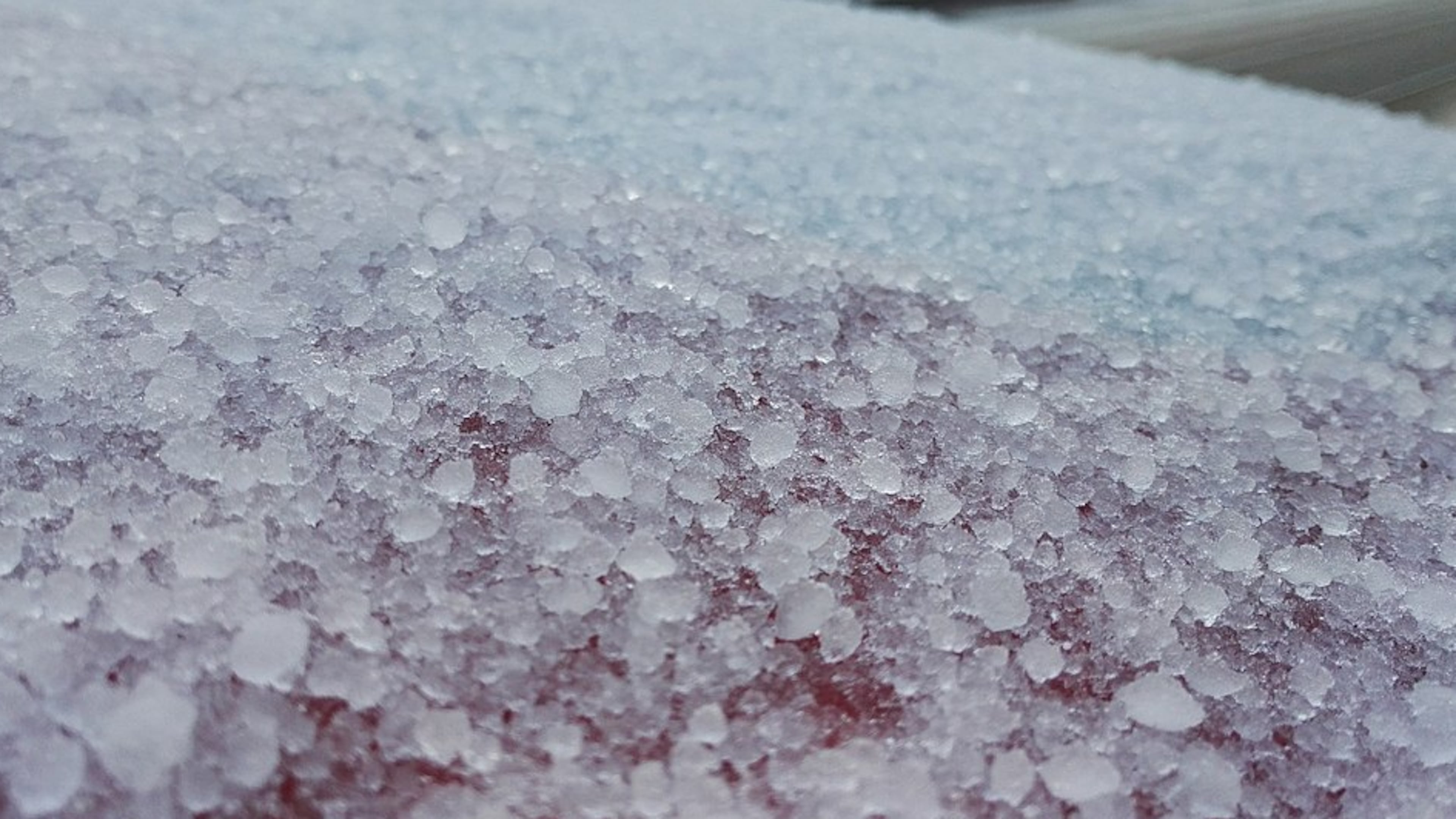 The soft, small pellets that are formed when supercooled water droplets freeze onto a snow crystal are known as graupel.