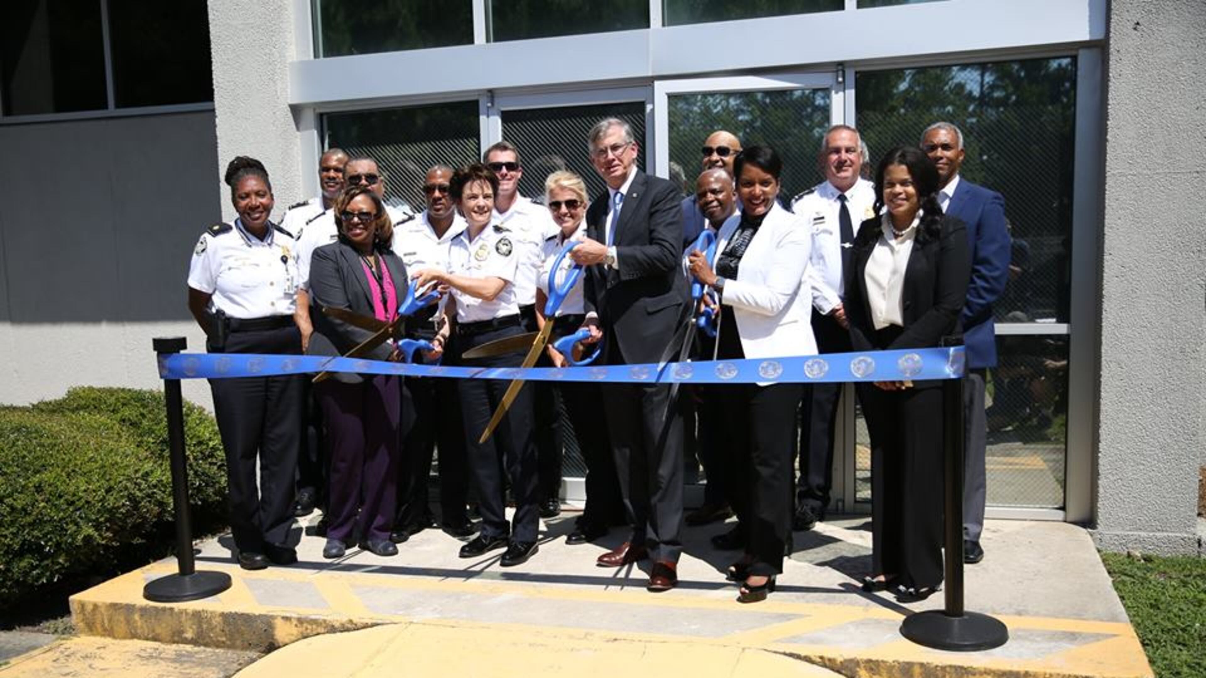 Mayor Keisha Lance Bottoms, Atlanta Police Chief Erika Shields and SunTrust Banks Inc. Chairman and Chief Executive Officer Bill Rogers celebrated the opening of a mini-precinct in Southwest Atlanta with a ribbon-cutting ceremony on Friday, June 22. CONTRIBUTED