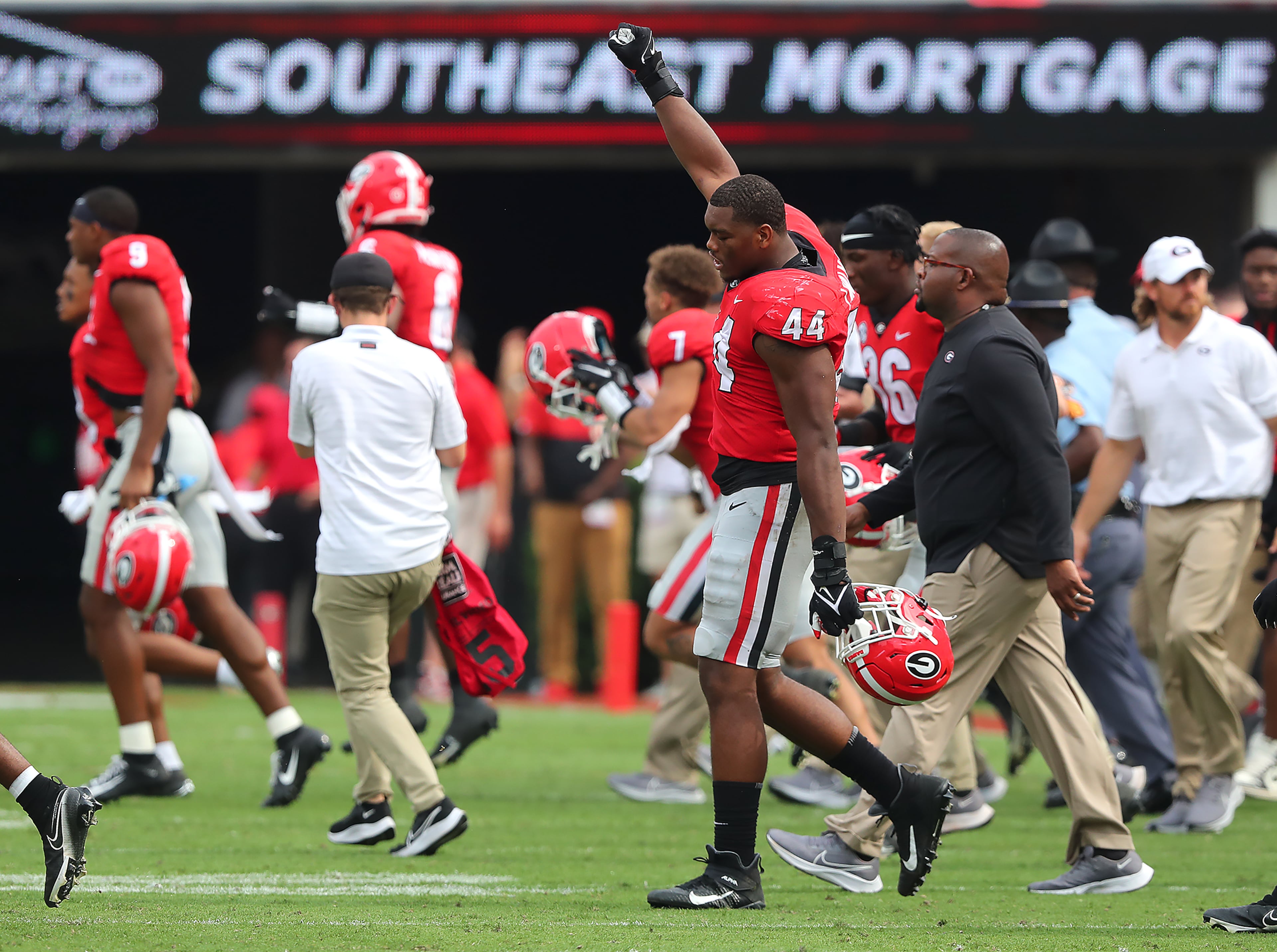 100221 ATHENS: Georgia defensive lineman Travon Walker and teammates celebrate a 37-0 victory over Arkansas in a NCAA college football game on Saturday, Oct. 2, 2021, in Athens. “Curtis Compton / Curtis.Compton@ajc.com”