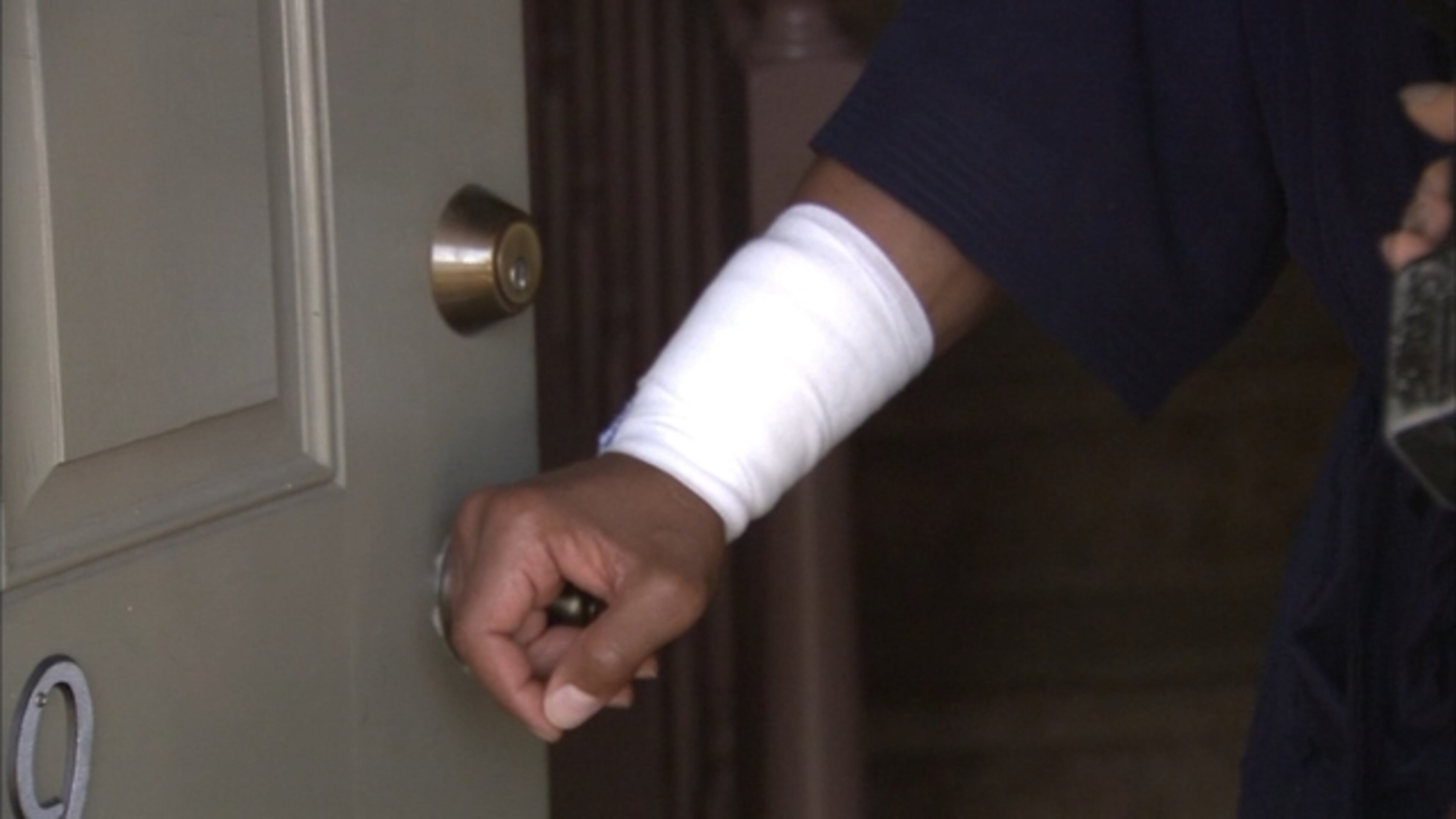 Gunmen in Lithonia shot through a door of a home in the 2700 block of Parkway Cove, hitting a man in the hand. (Credit: Channel 2 Action News)