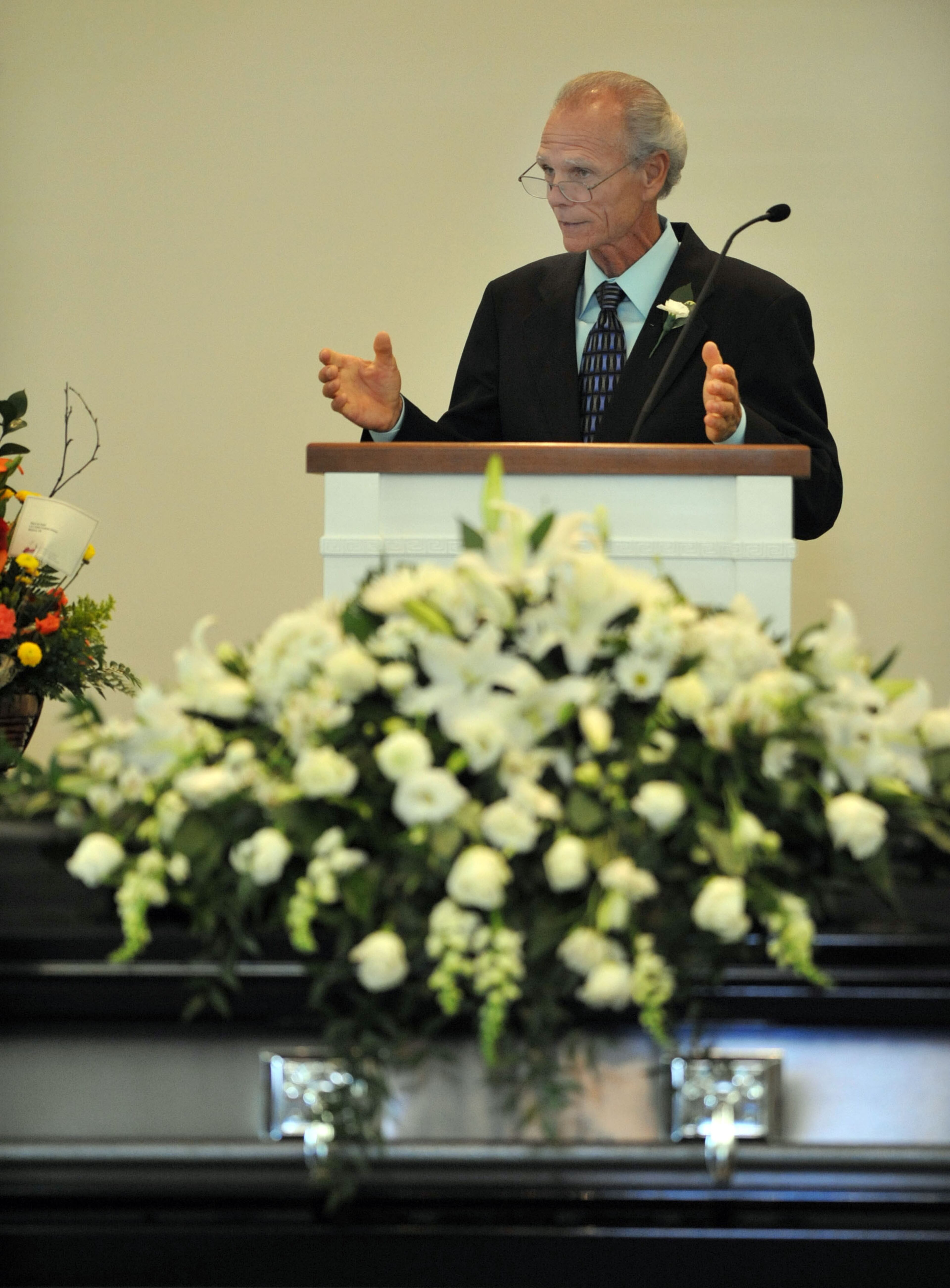 Rev. Wayne Powers gives the eulogy during the service at A.E. Carter Funeral Home in Madison, Ga. "He would help you in any way that he could," Powers said. Officer Hawk had served with the Eatonton Police Department for 12 years.