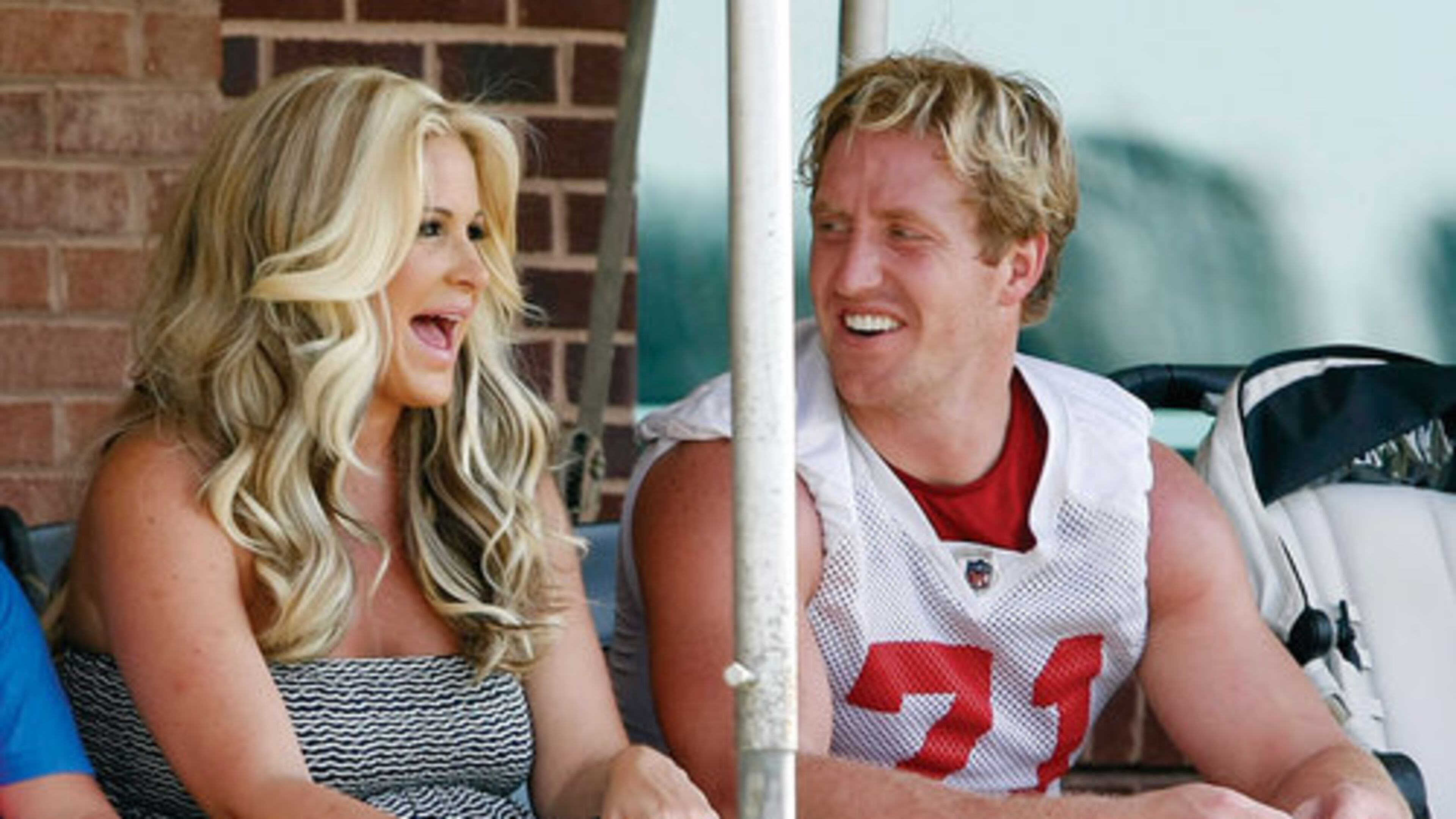 061912 FLOWERY BRANCH: Atlanta Falcons defensive end Kroy Biermann shares a laugh with his wife Kim Zolciak at the end of team practice on the first day of mini-camp in Flowery Branch on Tuesday, June 19, 2012. CURTIS COMPTON / CCOMPTON@AJC.COM 061912 FLOWERY BRANCH: Atlanta Falcons defensive end Kroy Biermann shares a laugh with his wife Kim Zolciak at the end of team practice on the first day of mini-camp in Flowery Branch on Tuesday, June 19, 2012. He never turned into a reality football star. CURTIS COMPTON / CCOMPTON@AJC.COM