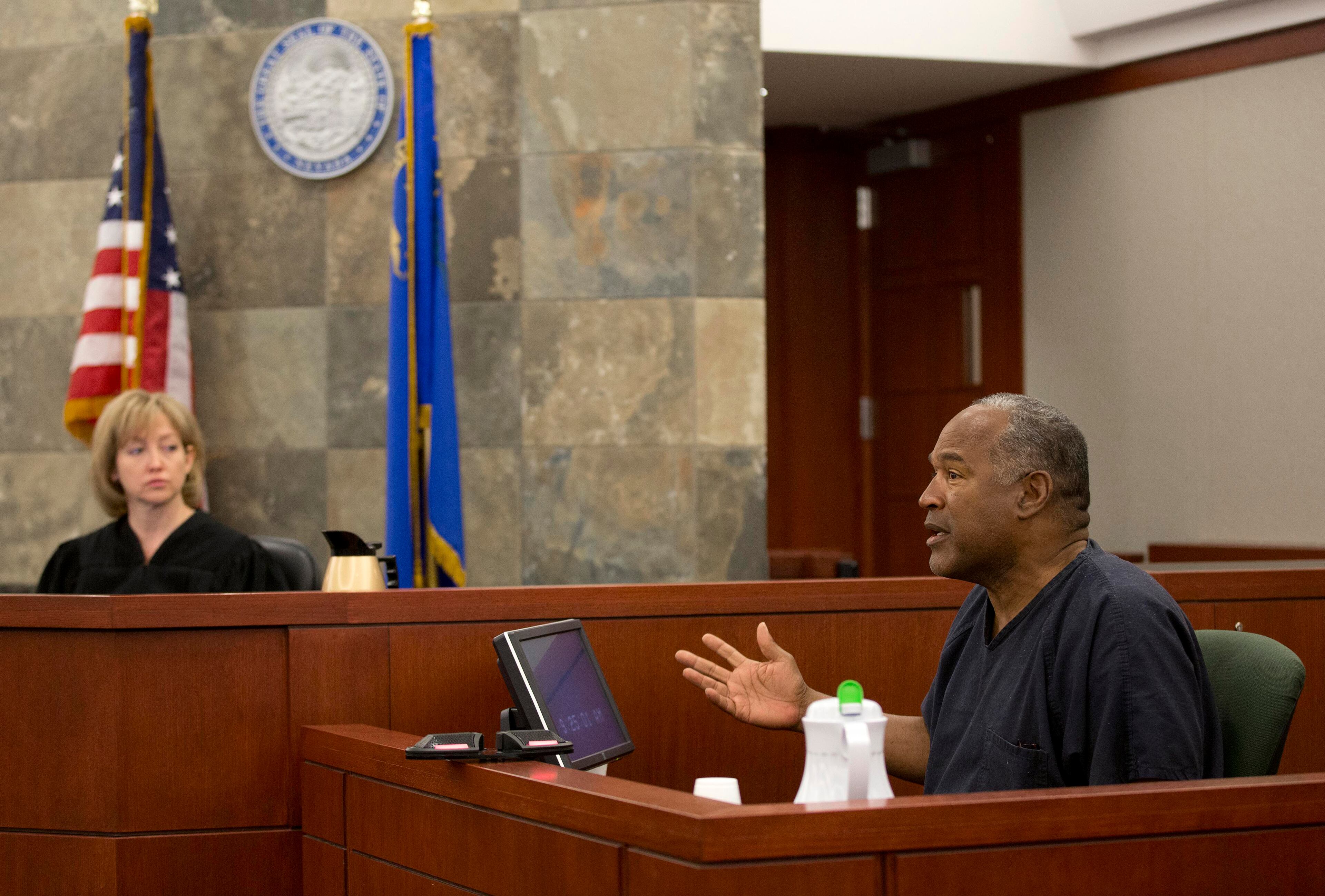 O.J. Simpson, right, testifies as Judge Linda Marie Bell listens during an evidentiary hearing in Clark County District Court in Las Vegas on May 15, 2013. Simpson, who is currently serving a nine- to 33-year sentence in state prison as a result of his October 2008 conviction for armed robbery and kidnapping charges, is using a writ of habeas corpus to seek a new trial, claiming he had such bad representation that his conviction should be reversed.