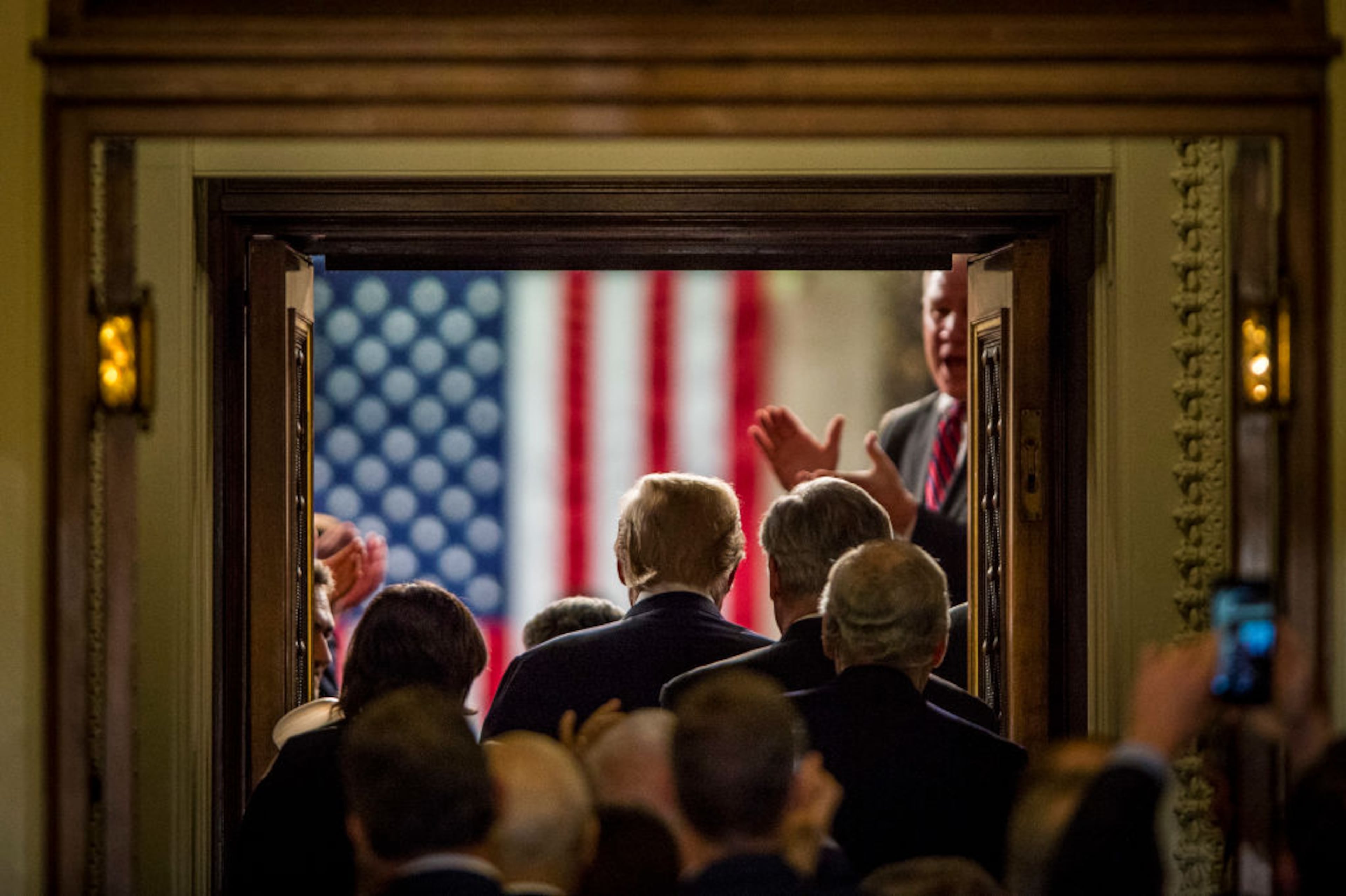 WASHINGTON, DC - JANUARY 30: U.S. President Donald Trump enters the House of Representatives chamber to deliver his first State of the Union Address before a joint session of Congress on January 30, 2018 in Washington, DC. This is the first State of the Union address given by the president and his second joint-session address to Congress. (Photo by Pete Marovich/Getty Images)