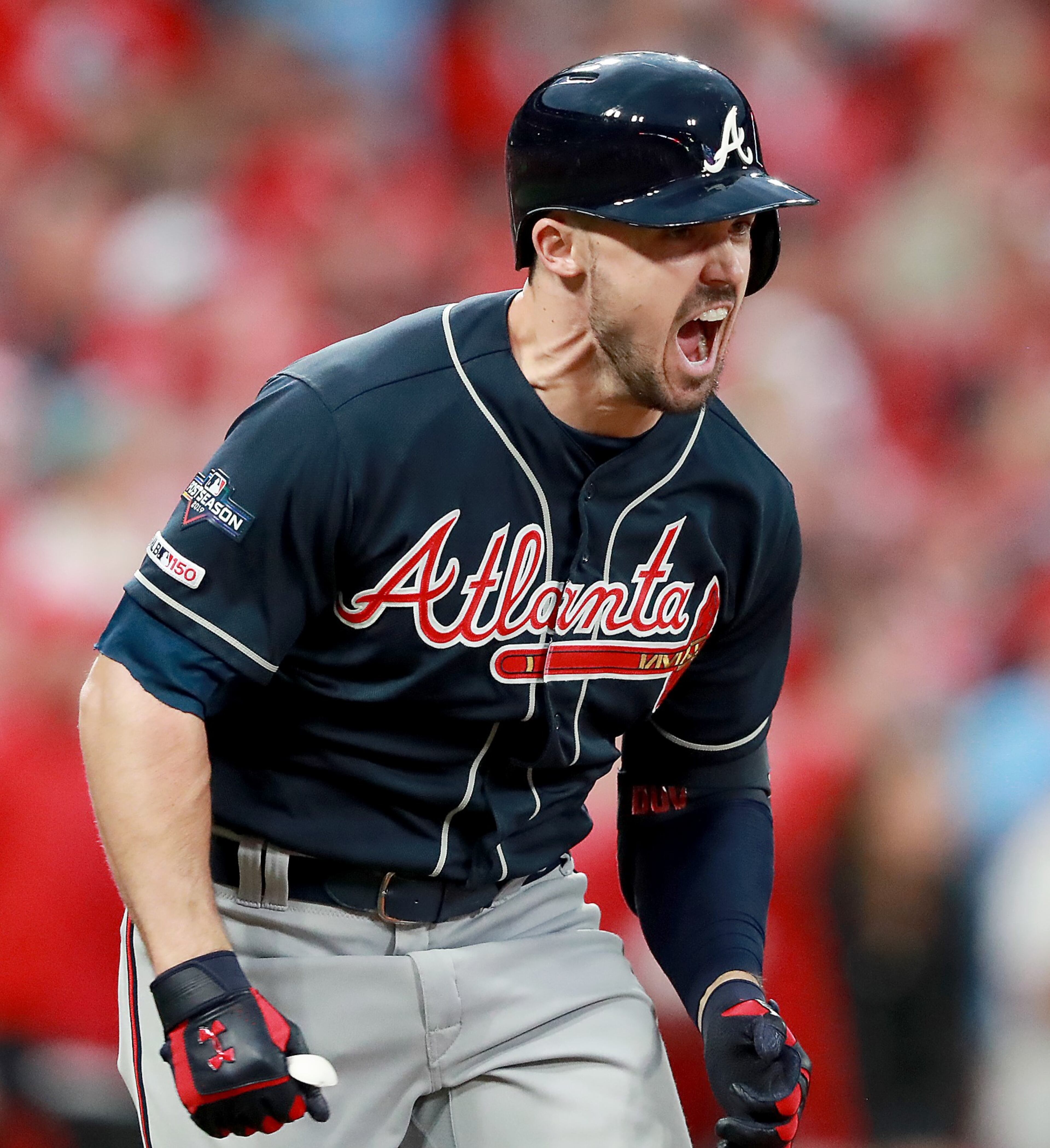 October 6, 2019 St. Louis, MO - Atlanta Braves left fielder Adam Duvall (23) celebrates on his way to first base after batting in two runs to give the Braves the lead, during Game 3 of best-of-five National League Division Series at Busch Stadium in St. Louis on Sunday, October 6, 2019. (Curtis Compton/ccompton@ajc.com)