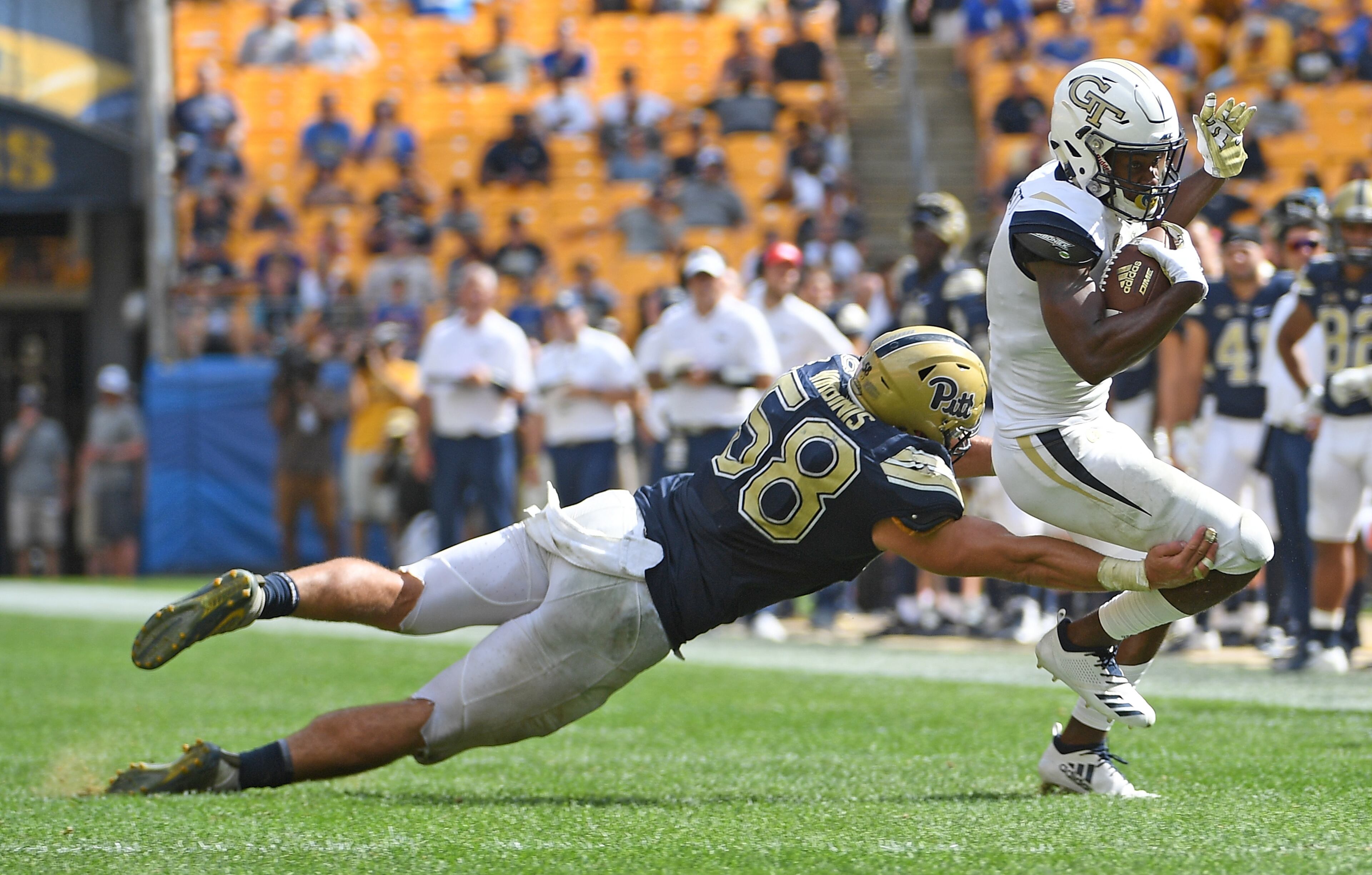 PITTSBURGH, PA - SEPTEMBER 15: Quintin Wirginis #58 of the Pittsburgh Panthers attempts to tackle Omahri Jarrett #2 of the Georgia Tech Yellow Jackets in the fourth quarter during the game at Heinz Field on September 15, 2018 in Pittsburgh, Pennsylvania. (Photo by Justin Berl/Getty Images)