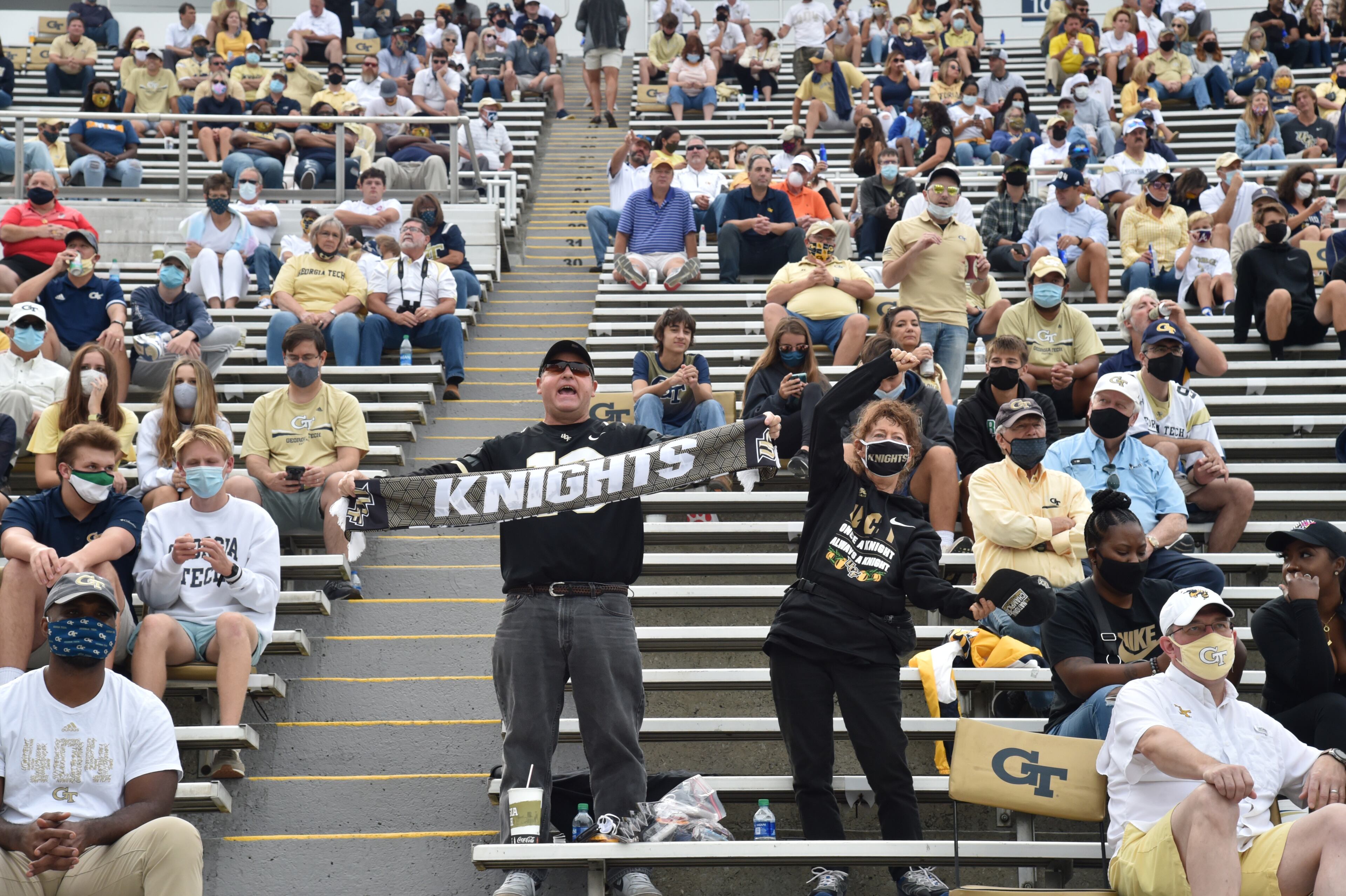 University of Central Florida fans cheer as they sit among Georgia Tech fans during the first half of an NCAA college football game at Georgia Tech's Bobby Dodd Stadium in Atlanta on Saturday, September 19, 2020. (Hyosub Shin / Hyosub.Shin@ajc.com)