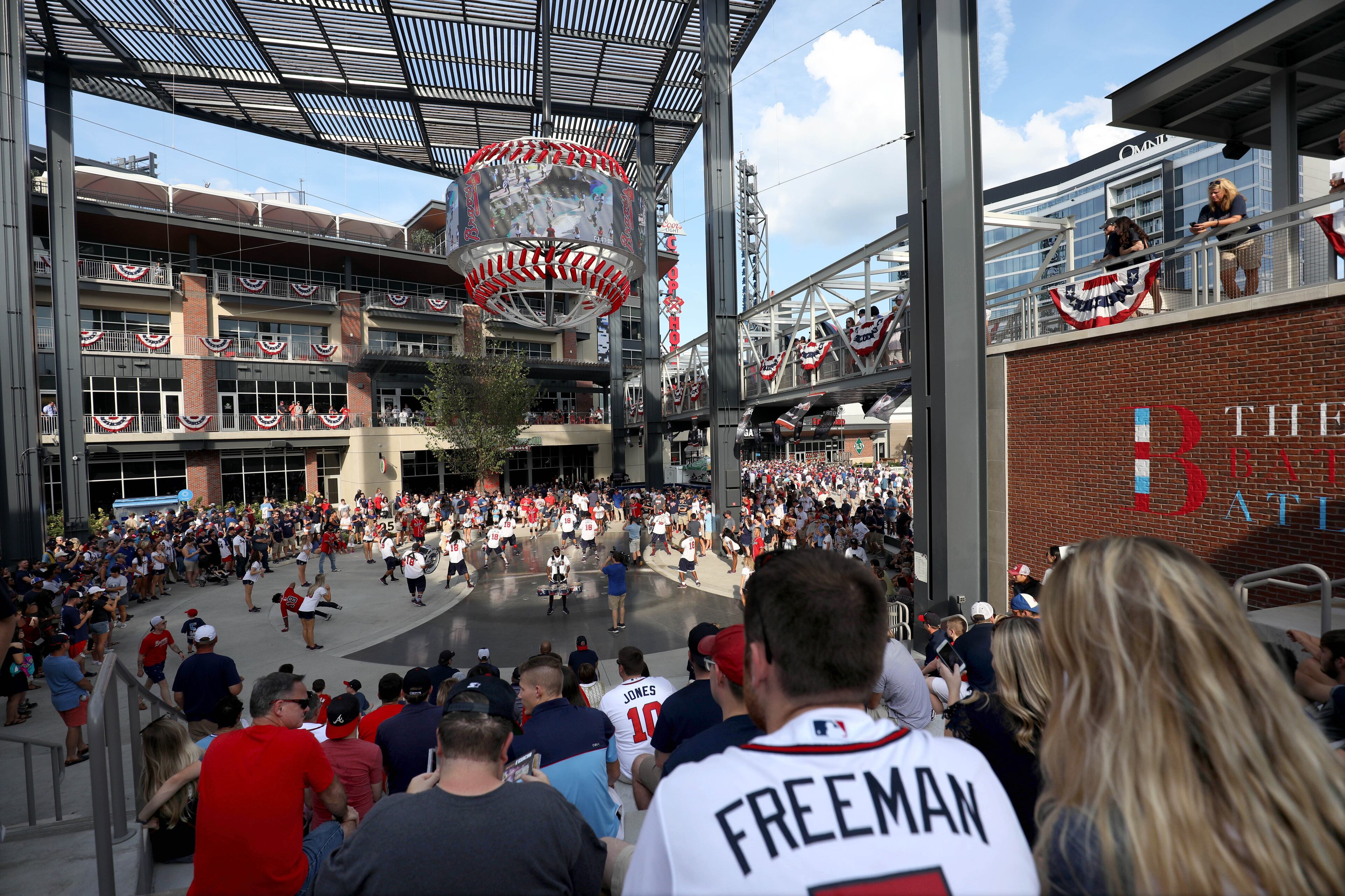 October 7, 2018 - Atlanta: Atlanta Braves fans watch the pregame festivities at the plaza before Game 3 between the Atlanta Braves and the Los Angeles Dodgers in a National League Division Series baseball game Sunday, October 7, 2018, in Atlanta. (JASON GETZ/SPECIAL TO THE AJC)