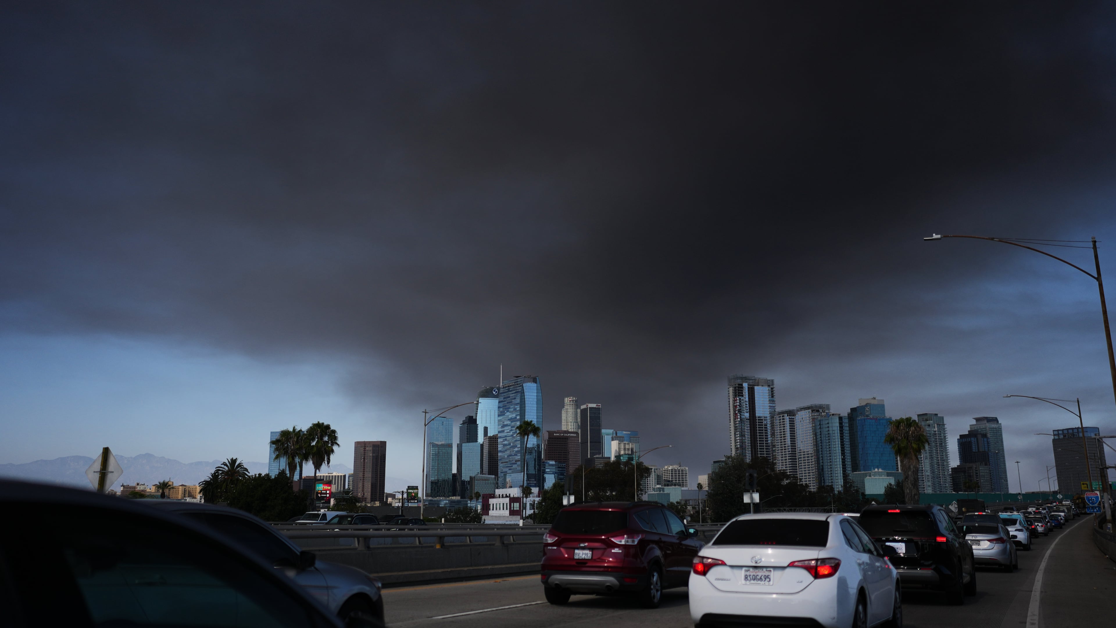 The sky is filled with smoke from a warehouse fire in Los Angeles on Wednesday, June 17, 2026. (AP Photo/Jae C. Hong)