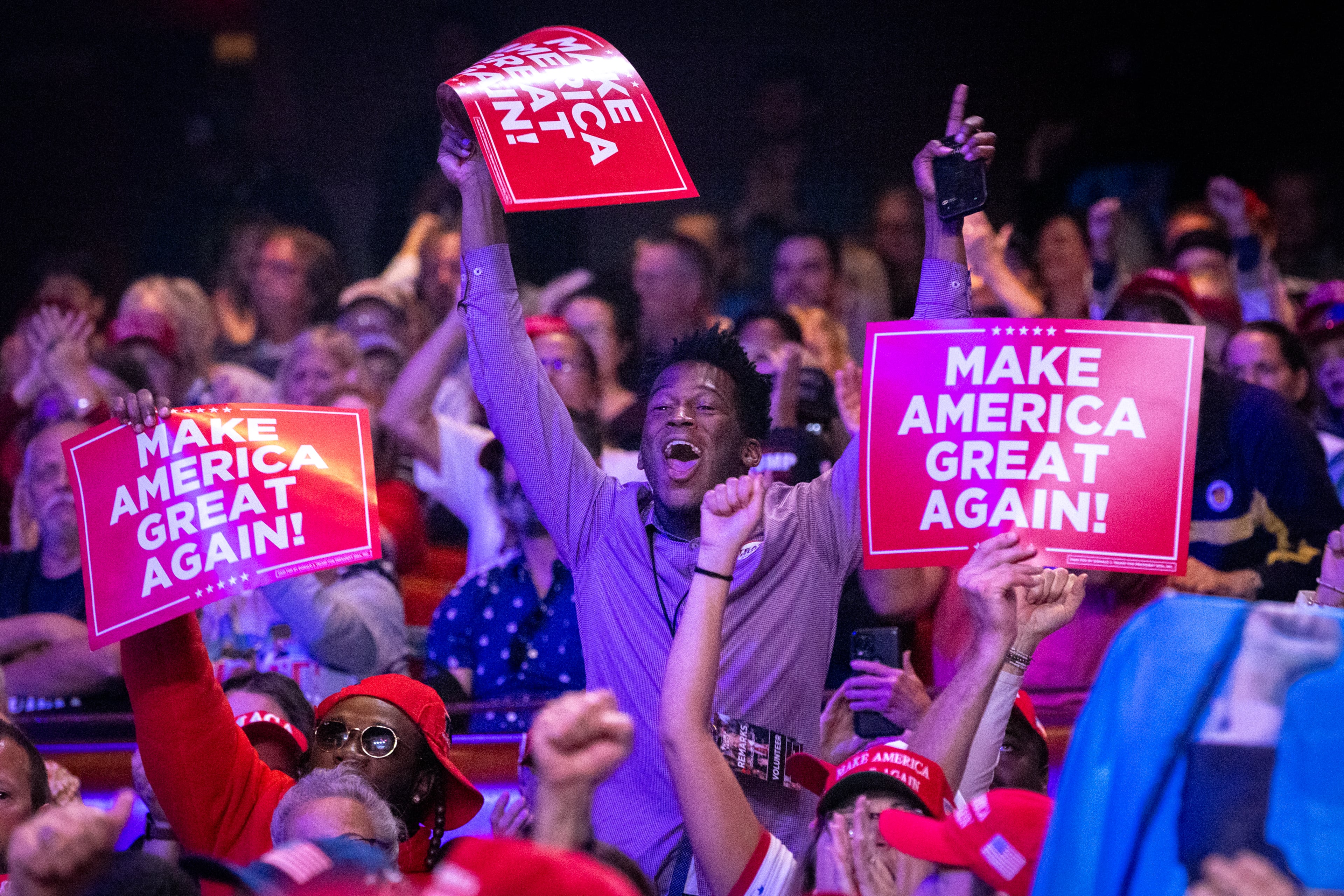 Supporters cheer for then-Republican presidential candidate Donald Trump as he speaks at his campaign rally at Cobb Energy Performing Arts Center in Cobb County on Tuesday, Oct. 15, 2024. (Arvin Temkar/AJC)
