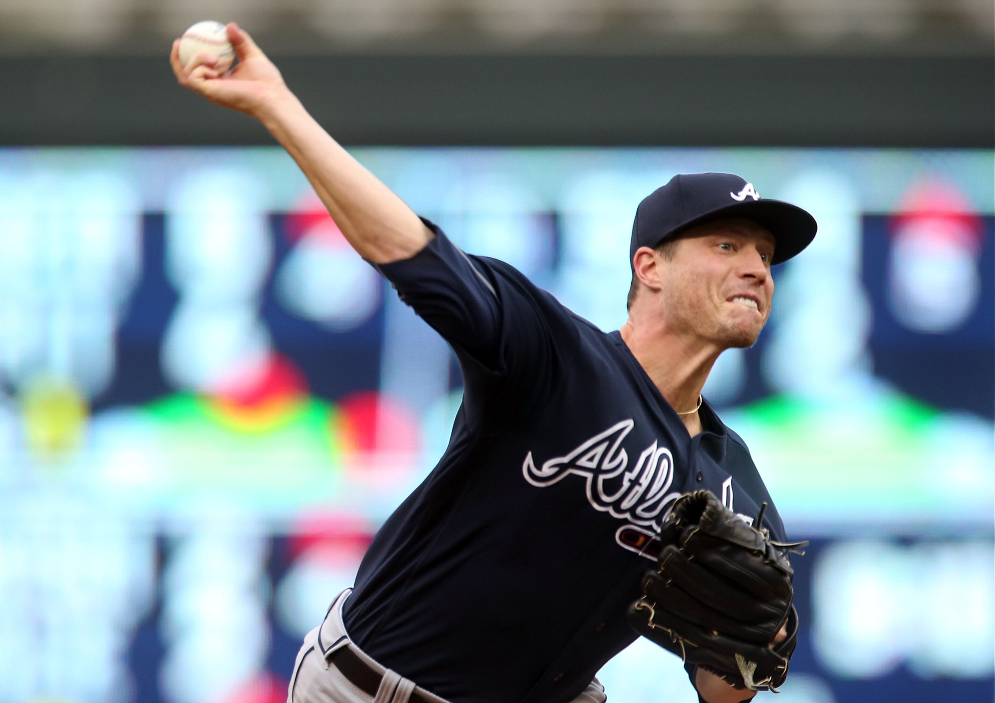 Atlanta Braves pitcher Lucas Harrell throws to a Minnesota Twins batter during the first inning of a baseball game Tuesday, July 26, 2016, in Minneapolis. (AP Photo/Jim Mone)