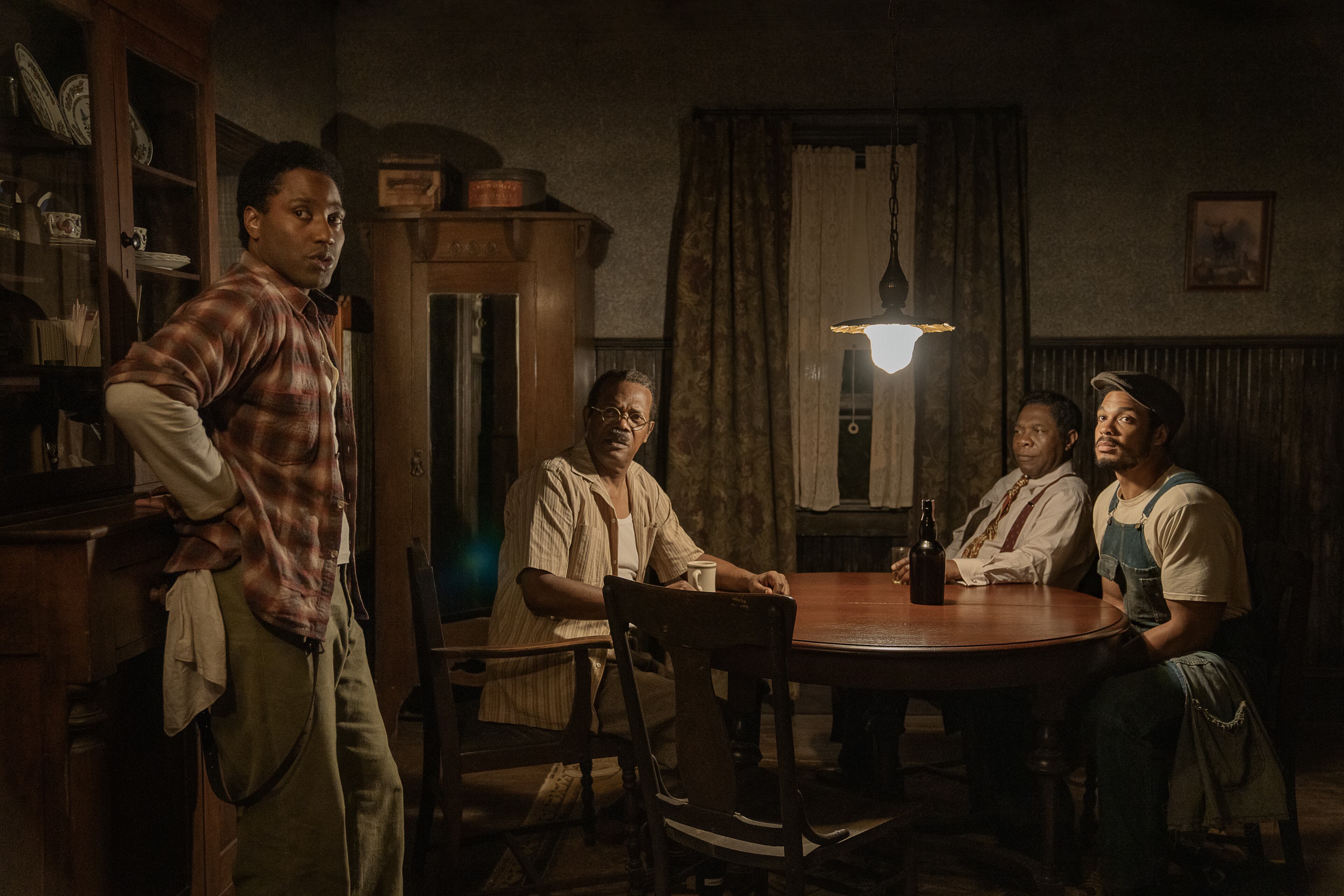 John David Washington as Boy Willie, Samuel L. Jackson as Doaker Charles, Michael Potts as Wining Boy and Ray Fisher as Lymon in "The Piano Lesson." Cr. David Lee/Netflix © 2024