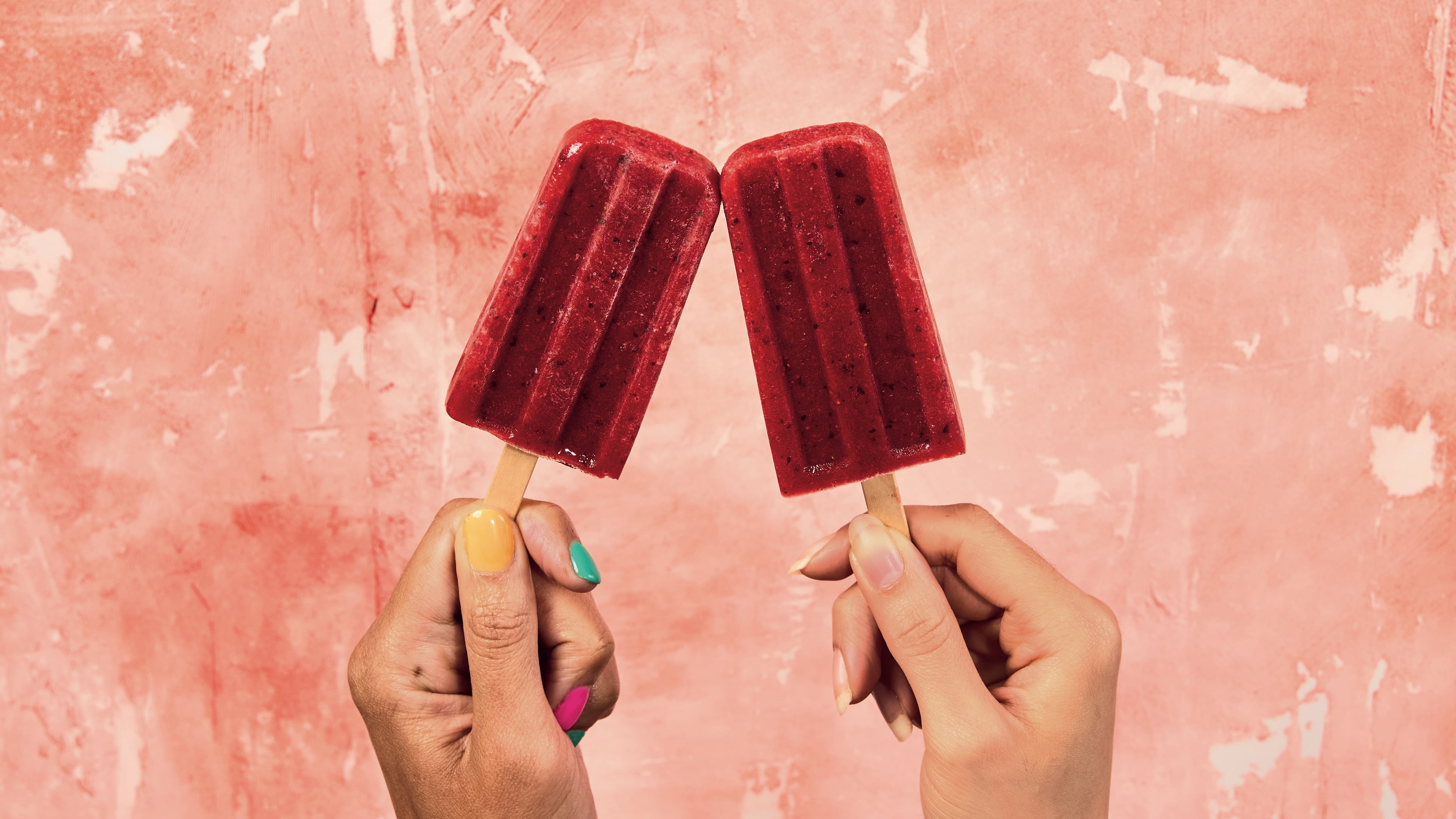 In his upcoming cookbook, “Back to Green: Rediscovering a World of Delicious, Healthy Eating,” Marcus Samuelsson offers a deliciously refreshing recipe for strawberry, basil and honey paletas. (Courtesy of Brittany Conerly)