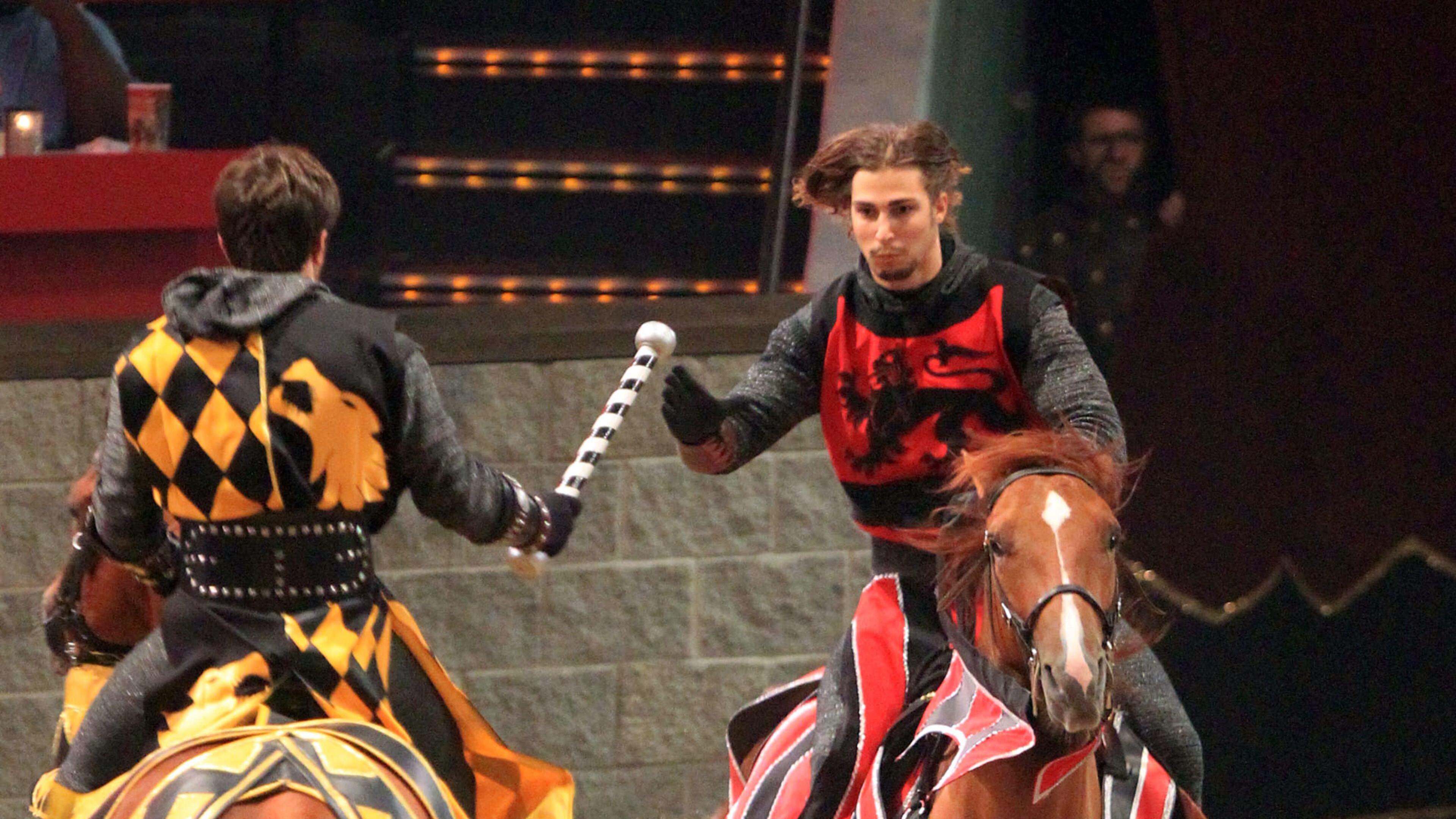 Medieval Times Red Knight Clint Mally, of Lawrenceville, 23, right, competes on his horse Peppy, a quarterhorse, during a relay race with other knights during the evening show at Discover Mills mall (currently Sugarloaf Mills mall) Saturday afternoon in Lawrenceville, Ga., July 28, 2012.
