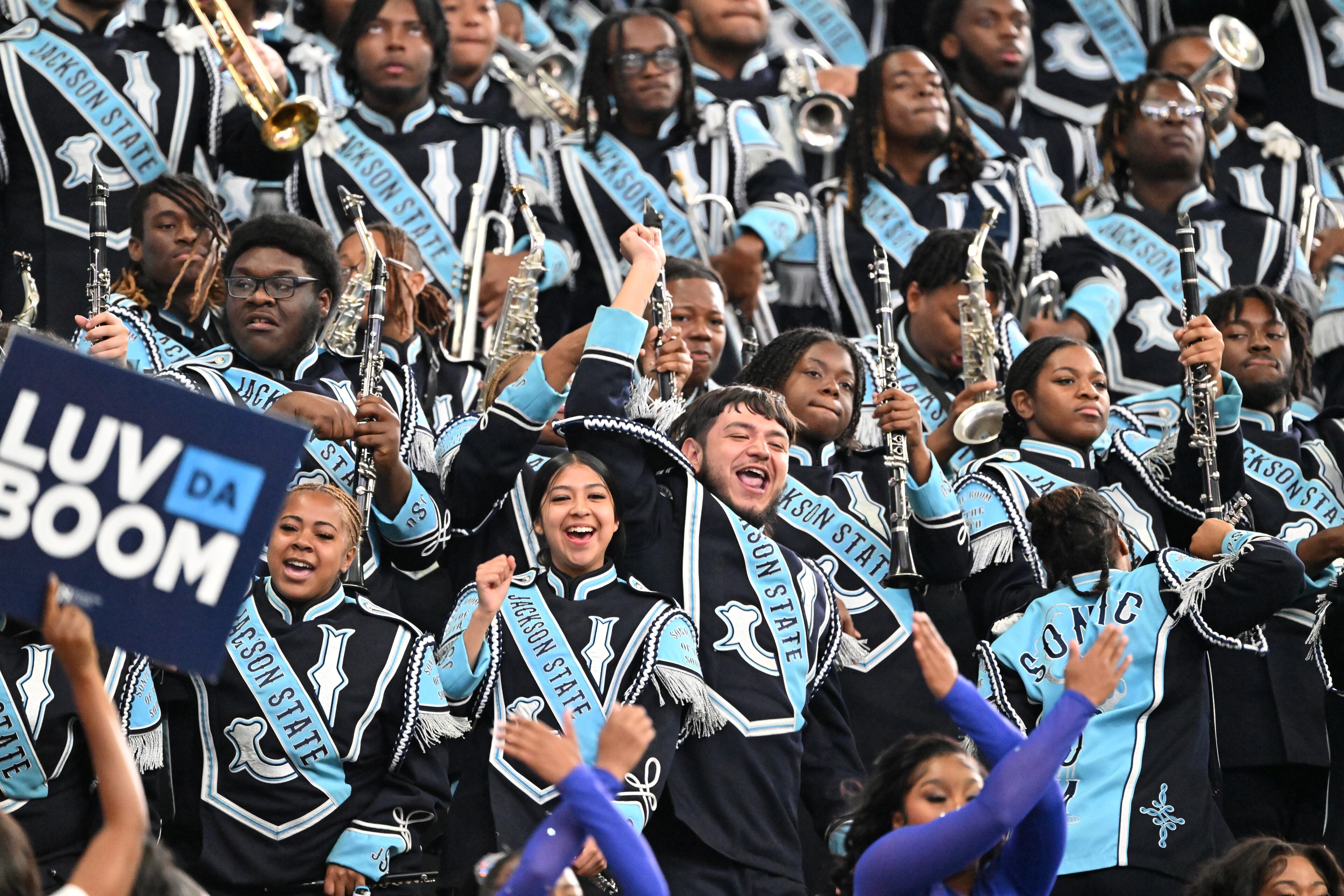 Jackson State marching band members cheer during the first half in 2024 Cricket Celebration Bowl at Mercedes-Benz Stadium, Saturday, December 14, 2024, in Atlanta. (Hyosub Shin / AJC)