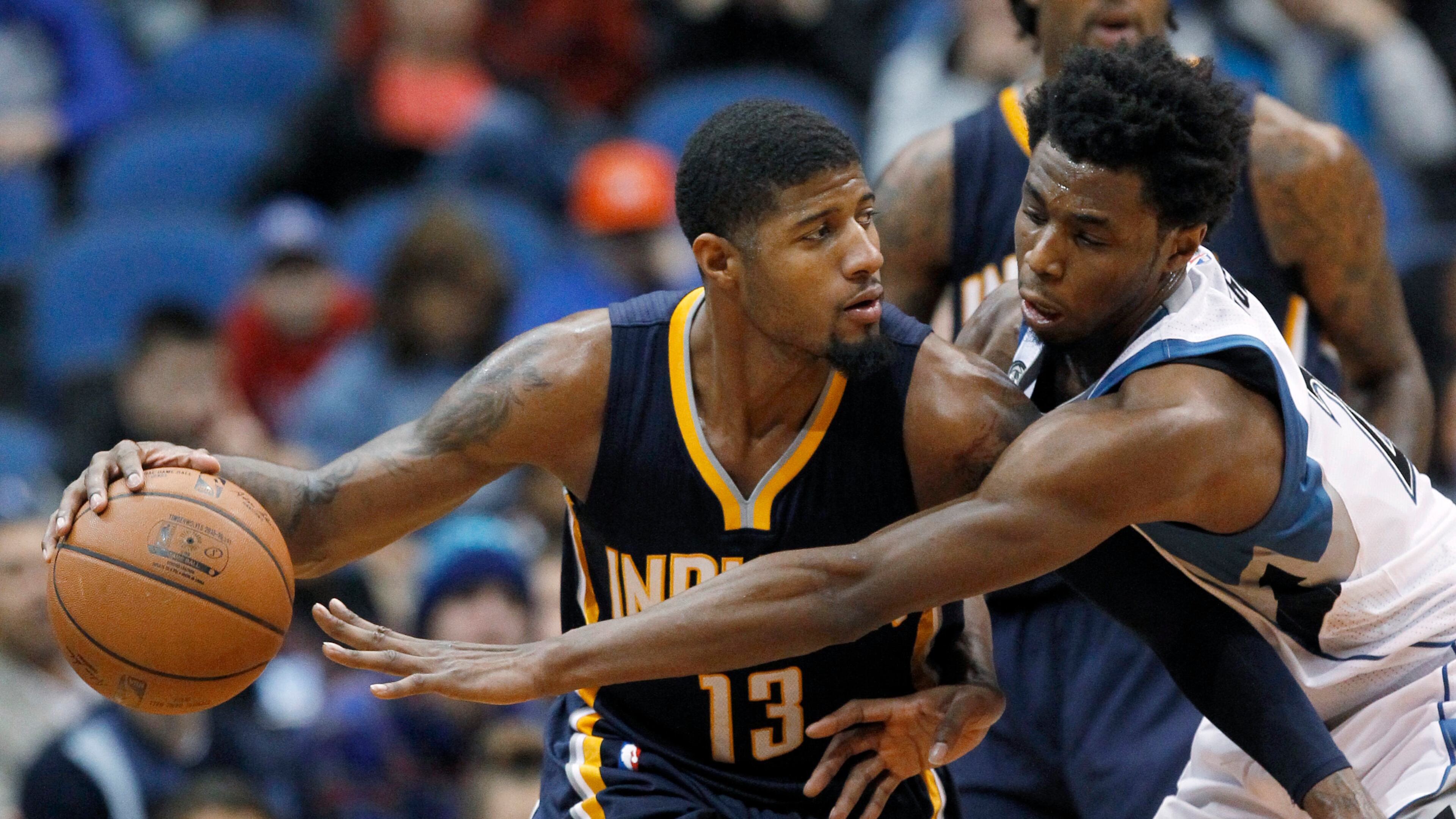 Indiana Pacers forward Paul George (13) drives against Minnesota Timberwolves guard Andrew Wiggins during the second half of an NBA basketball game in Minneapolis, Saturday, Dec. 26, 2015. The Pacers won 102-88. (AP Photo/Ann Heisenfelt)