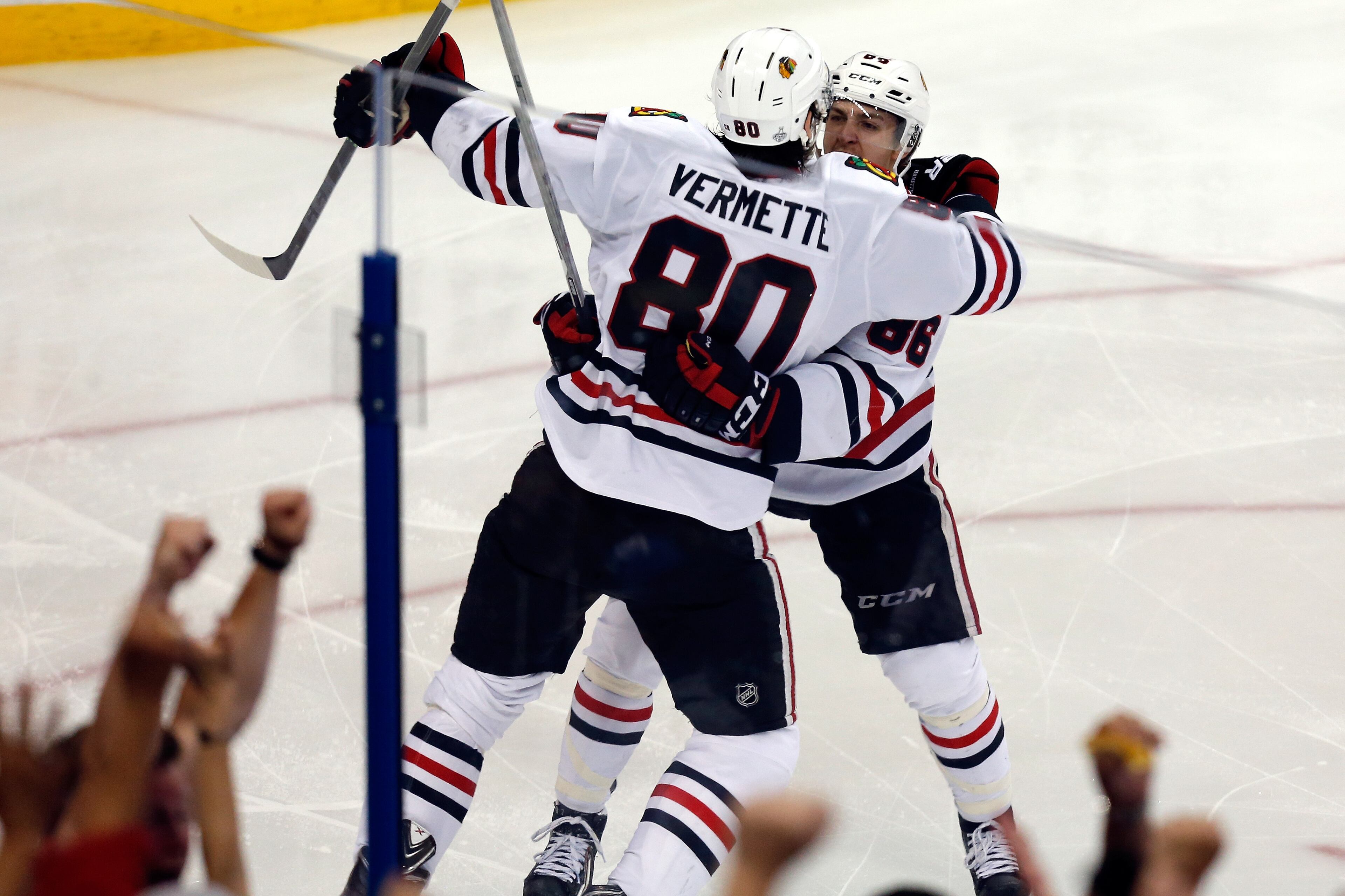 TAMPA, FL - JUNE 13: Antoine Vermette #80 of the Chicago Blackhawks celebrates with his teammate Teuvo Teravainen #86 after scoring a goal in the third period against the Tampa Bay Lightning during Game Five of the 2015 NHL Stanley Cup Final at Amalie Arena on June 13, 2015 in Tampa, Florida. (Photo by Mike Carlson/Getty Images)