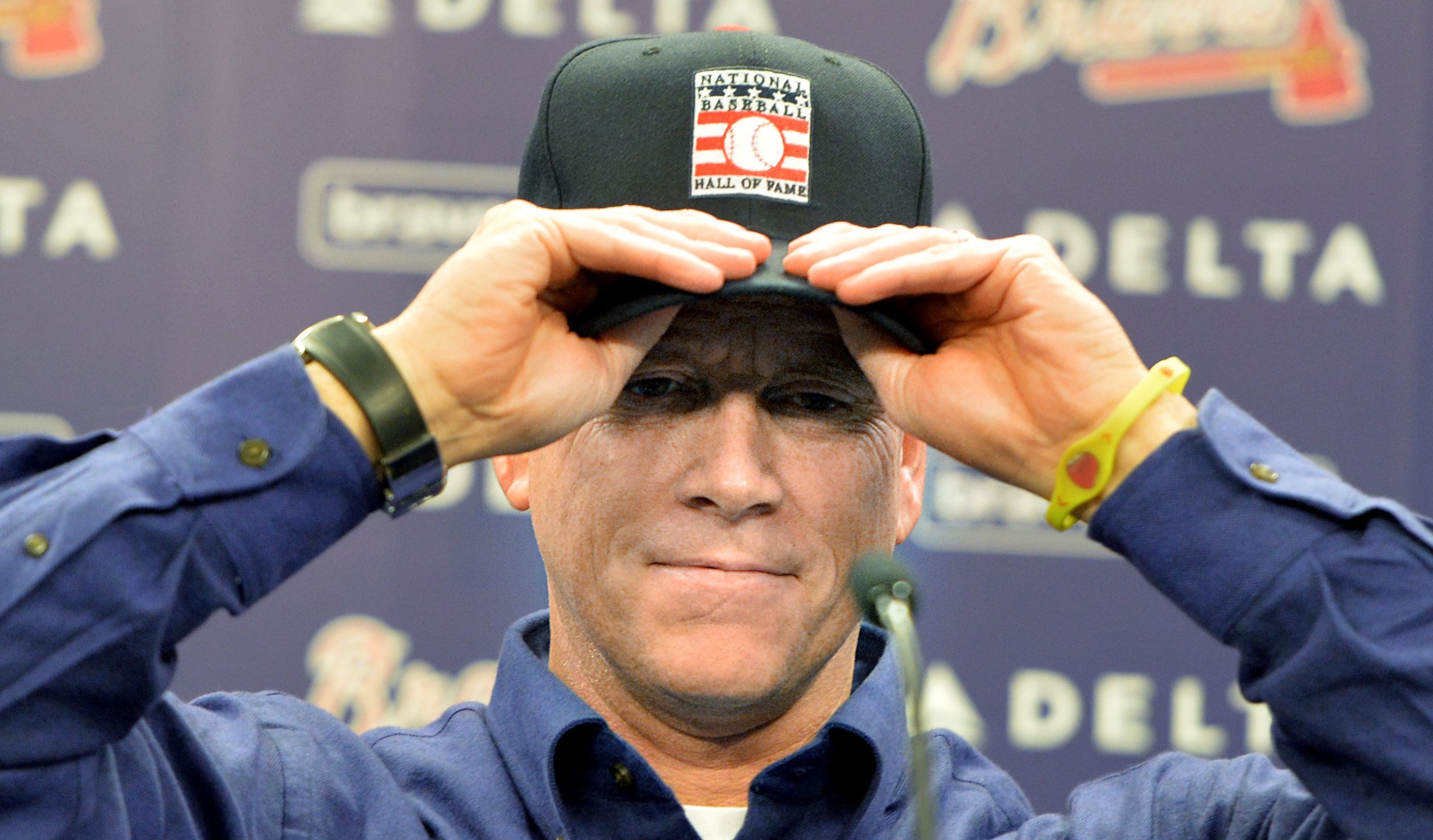 Former Braves pitcher Tom Glavine wears his Baseball Hall of Fame cap after he, Greg Maddux and Frank Thomas were elected to the baseball Hall of Fame during a news conference at Turner Field on Wednesday, January 8 , 2014. Former Braves pitchers Greg Maddux and Tom Glavine to join former manager Bobby Cox. Greg Maddux had 97.2 percent of the vote, Tom Glavine garnered 91.9 percent.
