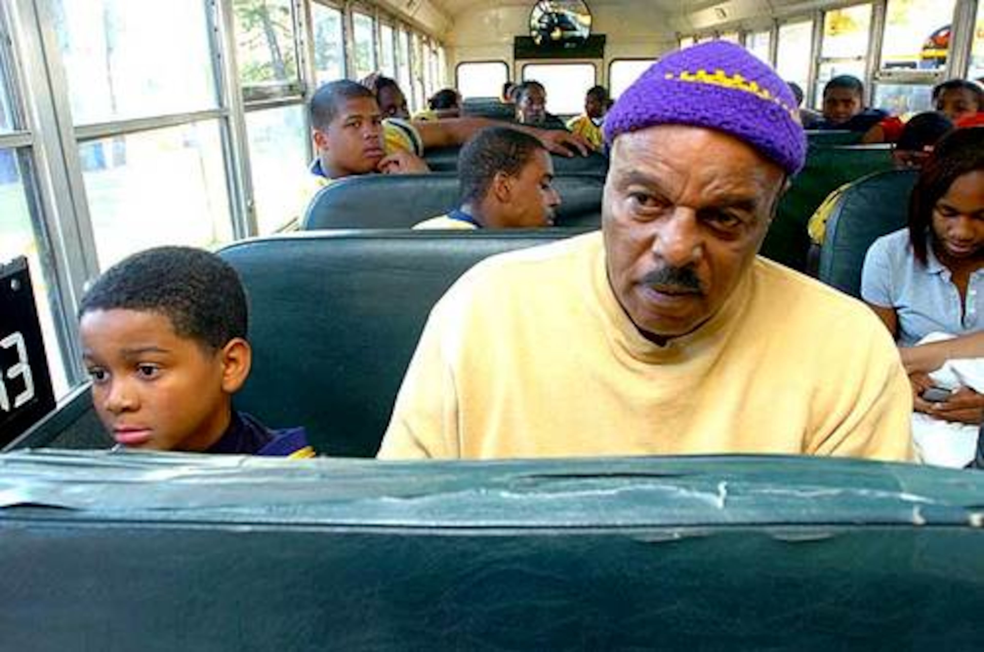 Coach loves kids. And kids love Coach. Just ask Panthers ball boy Nicholas Evans, 10, (left, with Godfrey) who wants to play for SWD when he's in high school. "Kids need so much these days," he says. "You can't save them all, but the ones you do -- man -- that's a great feeling."