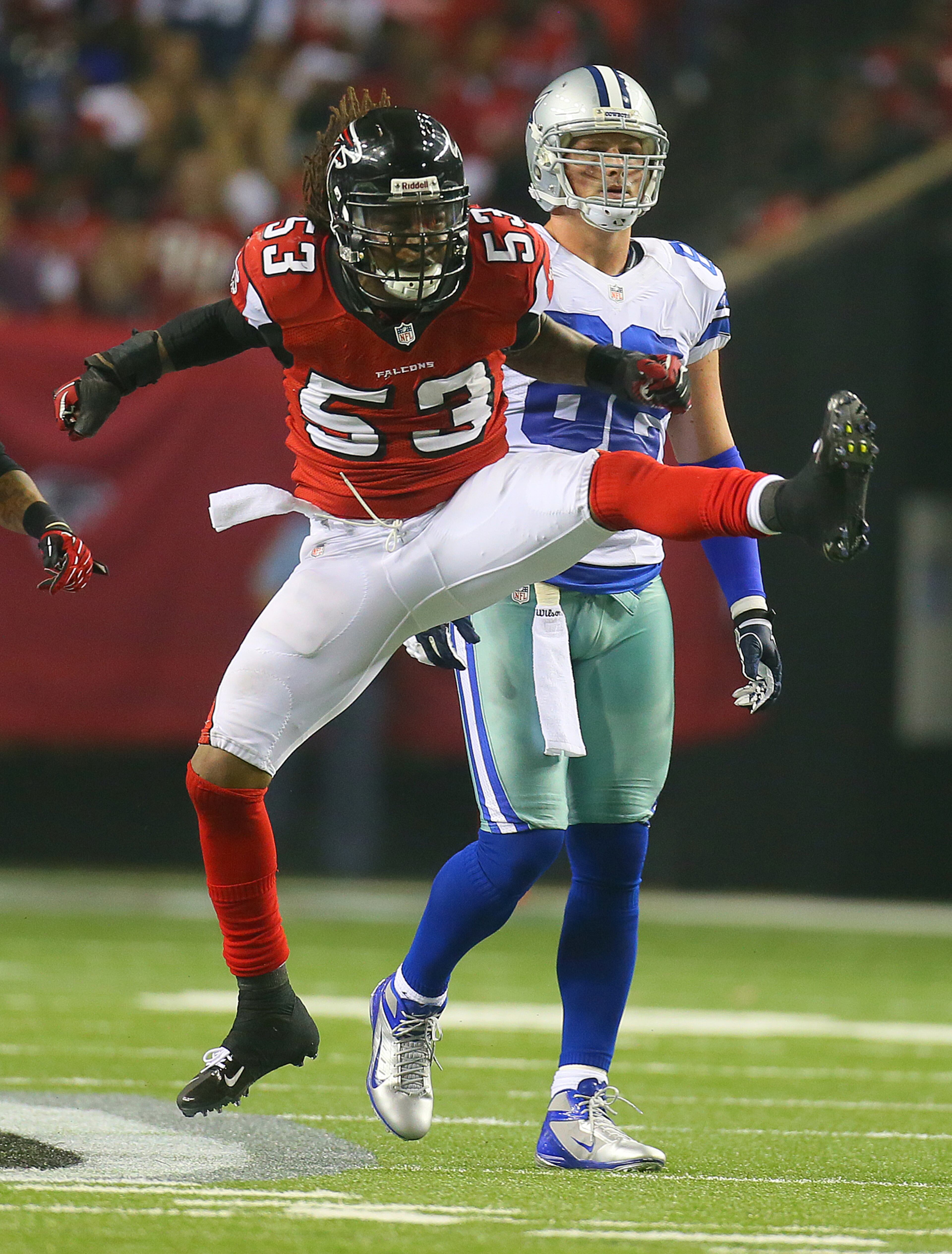 Atlanta Falcons linebacker Mike Peterson kicks up his heels reacting as the defenses makes a big stop on Cowboys running back Phillip Tanner on third down forcing Dallas to punt on fourth down in the final minutes of the first half at the Georgia Dome in Atlanta on Sunday, Nov. 4, 2012. The Falcons drove for a field goal after the play to tie the game 6-6 at the half. CURTIS COMPTON / CCOMPTON@AJC.COM