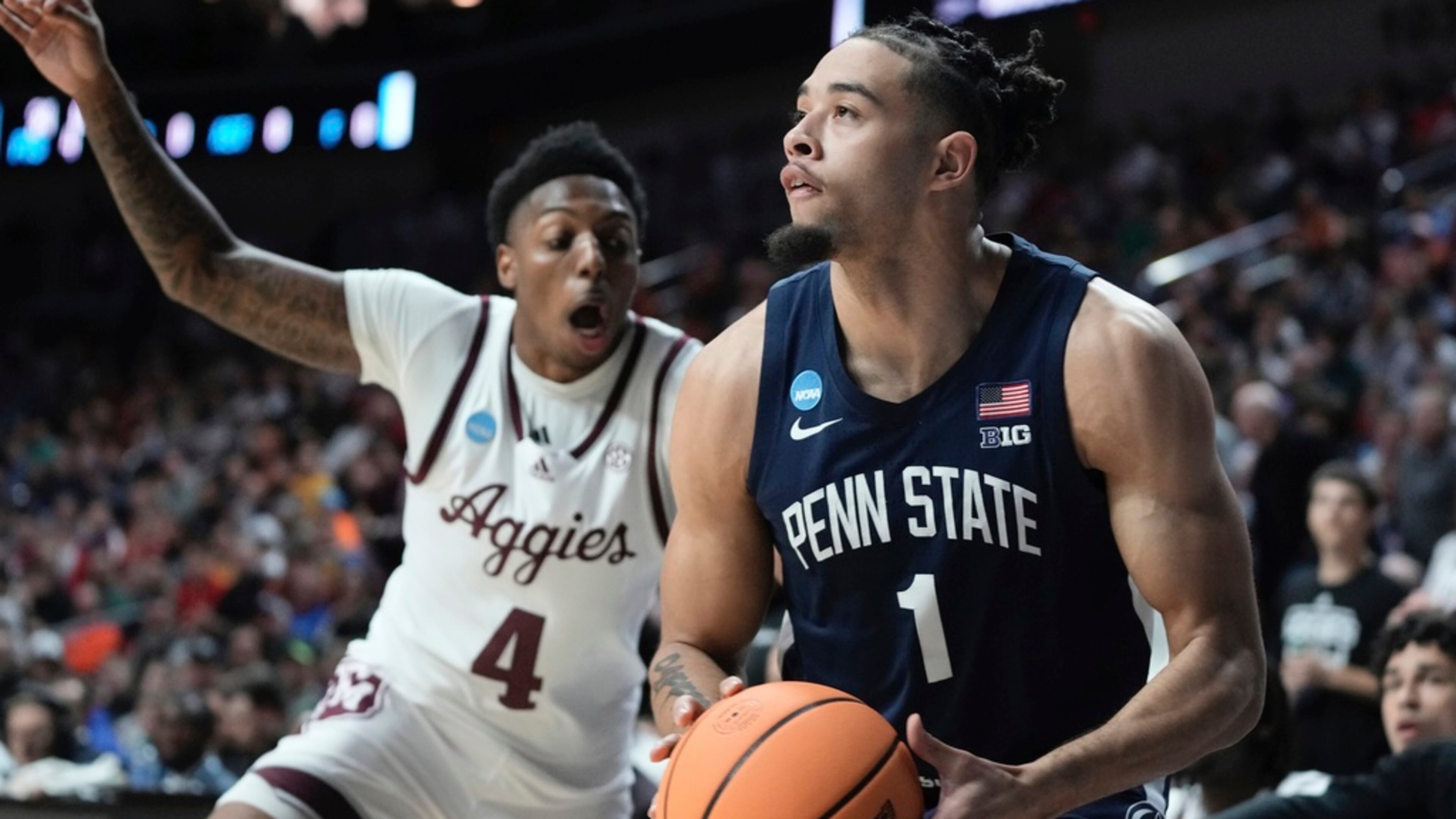 Penn State's Seth Lundy shoots past Texas A&M's Wade Taylor IV during the first half of a first-round college basketball game in the NCAA Tournament Thursday, March 16, 2023, in Des Moines, Iowa. (AP Photo/Morry Gash)