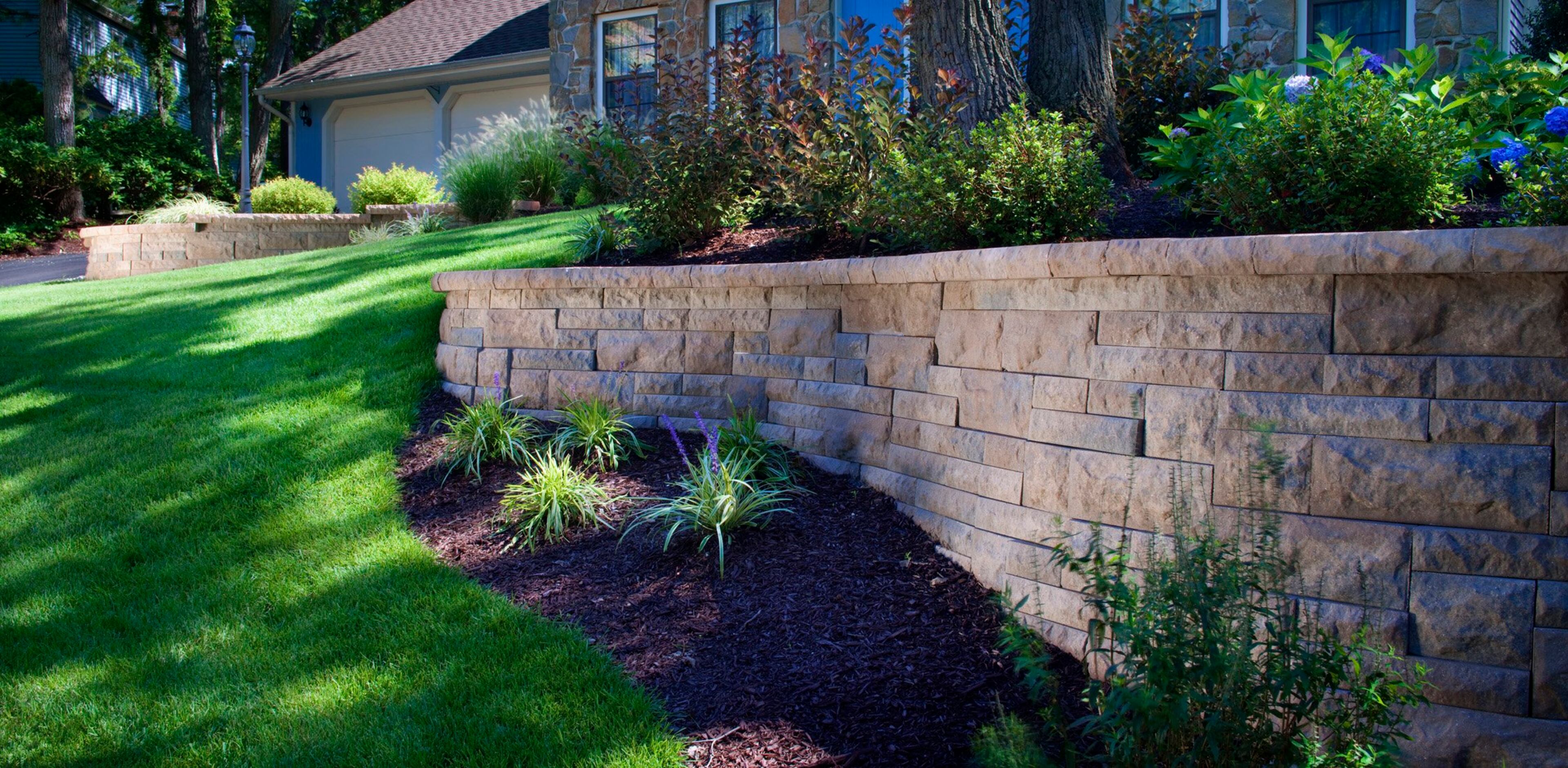 Homeowners are incorporating retaining walls into their front and back yard landscaping designs. Retaining walls can be used as ways to add built-in seating and raised-bed gardens.
