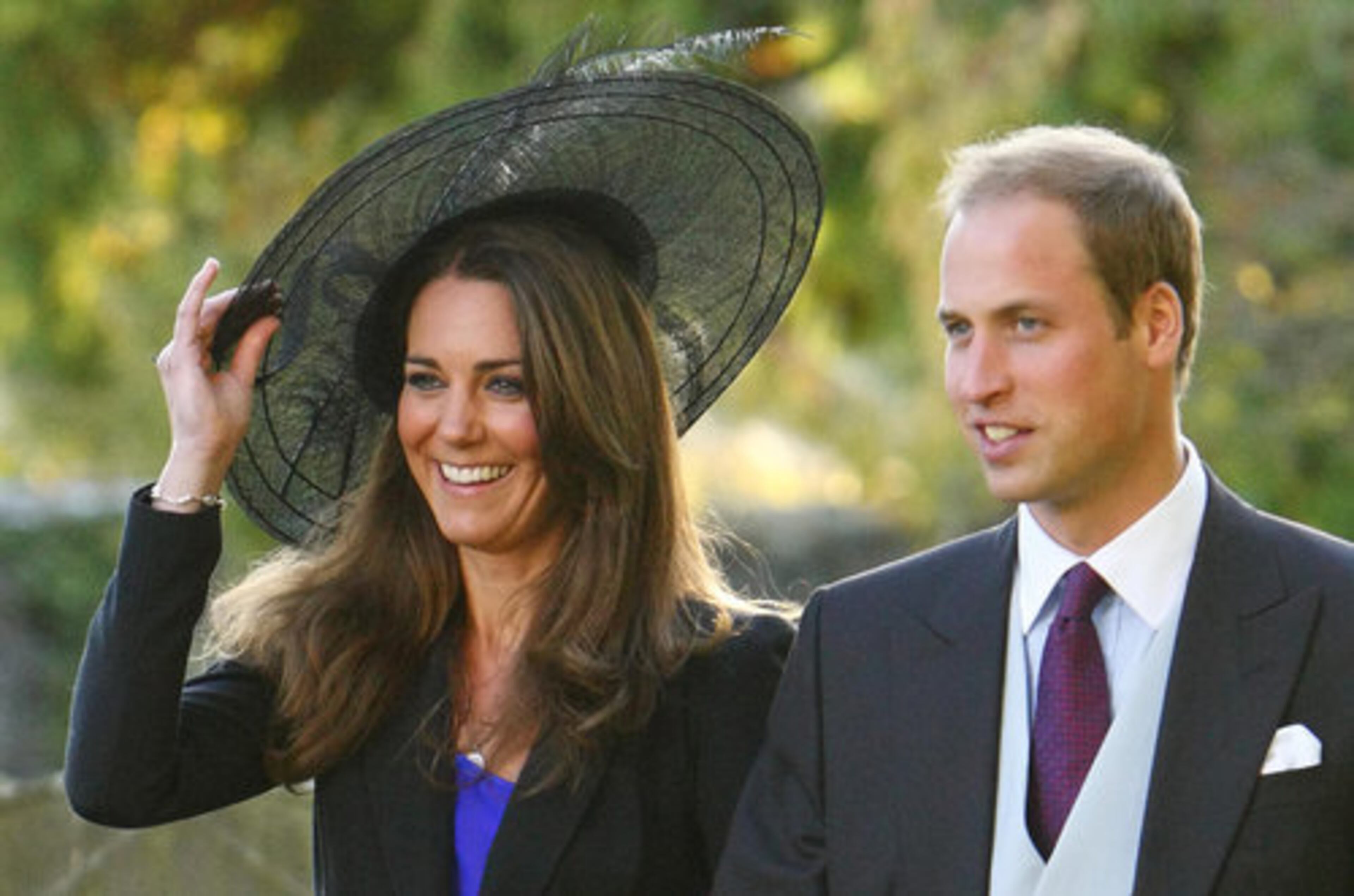 Britain's Prince William and Kate Middleton leave the wedding of their friends Harry Mead and Rosie Bradford in the village of Northleach, England, in this October 23, 2010, file photo. The prince's engagement was announced on Tuesday, Nov. 16, 2010.