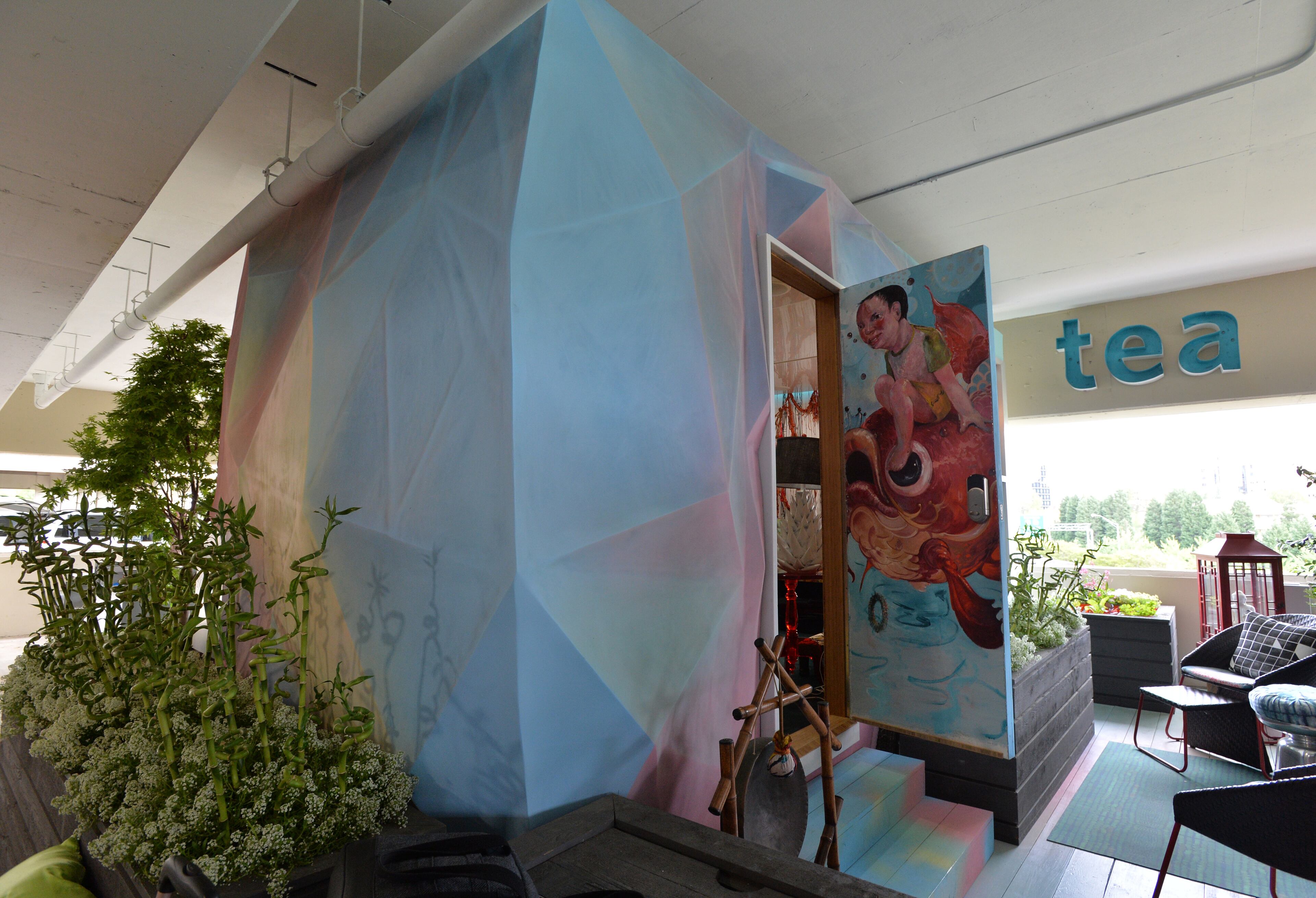 Exterior of SCADpad Asia, one of three fully functional and fully furnished 135-square-foot SCADpad units, on the 4th floor of SCAD Atlanta's parking garage on Tuesday, April 15, 2014. Inside SCADpad Asia, a geometic wallpaper adorns the walls, which was painted by BFA and MFA painting graduate Liz Winnel. The wallpaper overlays a soundboard designed by SCAD student Ross Fish. When you touch the wall, an algorithm is triggered to produce randomized audio file sounds. Savannah College of Art and Design (SCAD) unveiled SCADpad, a unique micro-housing and adaptive reuse experiment that transformed the parking structure of its midtown Atlanta location into a sustainable community that proposes an answer to the world's growing urban housing challenges. HYOSUB SHIN / HSHIN@AJC.COM