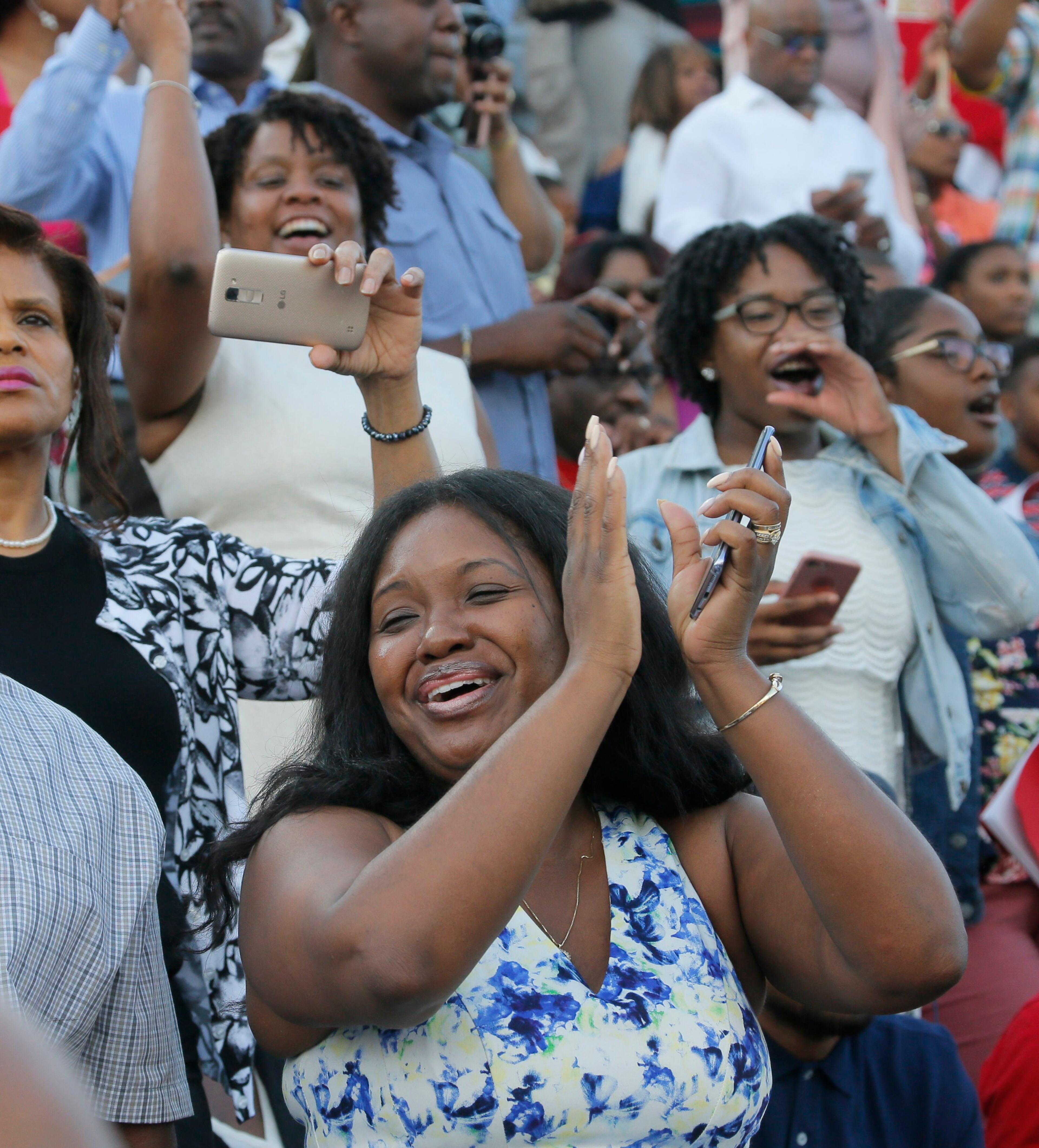 5/22/17 - Atlanta - Family members watch as graduates enter the stadium during the processional. Clark Atlanta University's Panther Stadium was the site of their 28th annual Commencement. Businessman William Pickard gave the commencement address. Rev. Jesse Jackson, who received an honorary degree also spoke. Panther Stadium, BOB ANDRES /BANDRES@AJC.COM