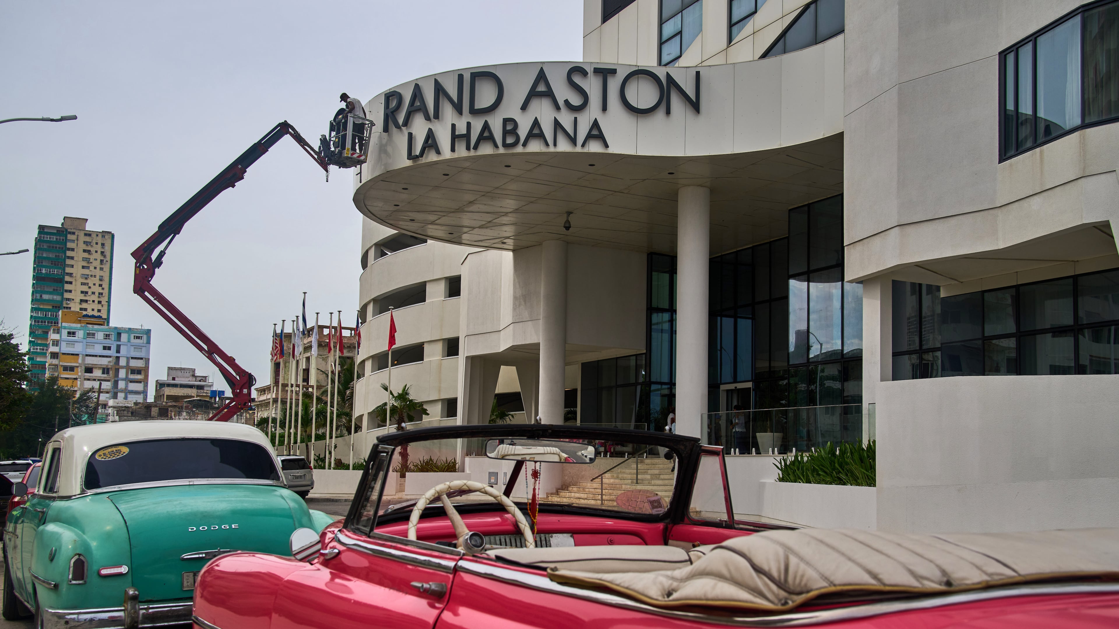 Workers repair the sign at the Grand Aston Hotel in Havana, Wednesday, June 3, 2026. (AP Photo/Ramon Espinosa)