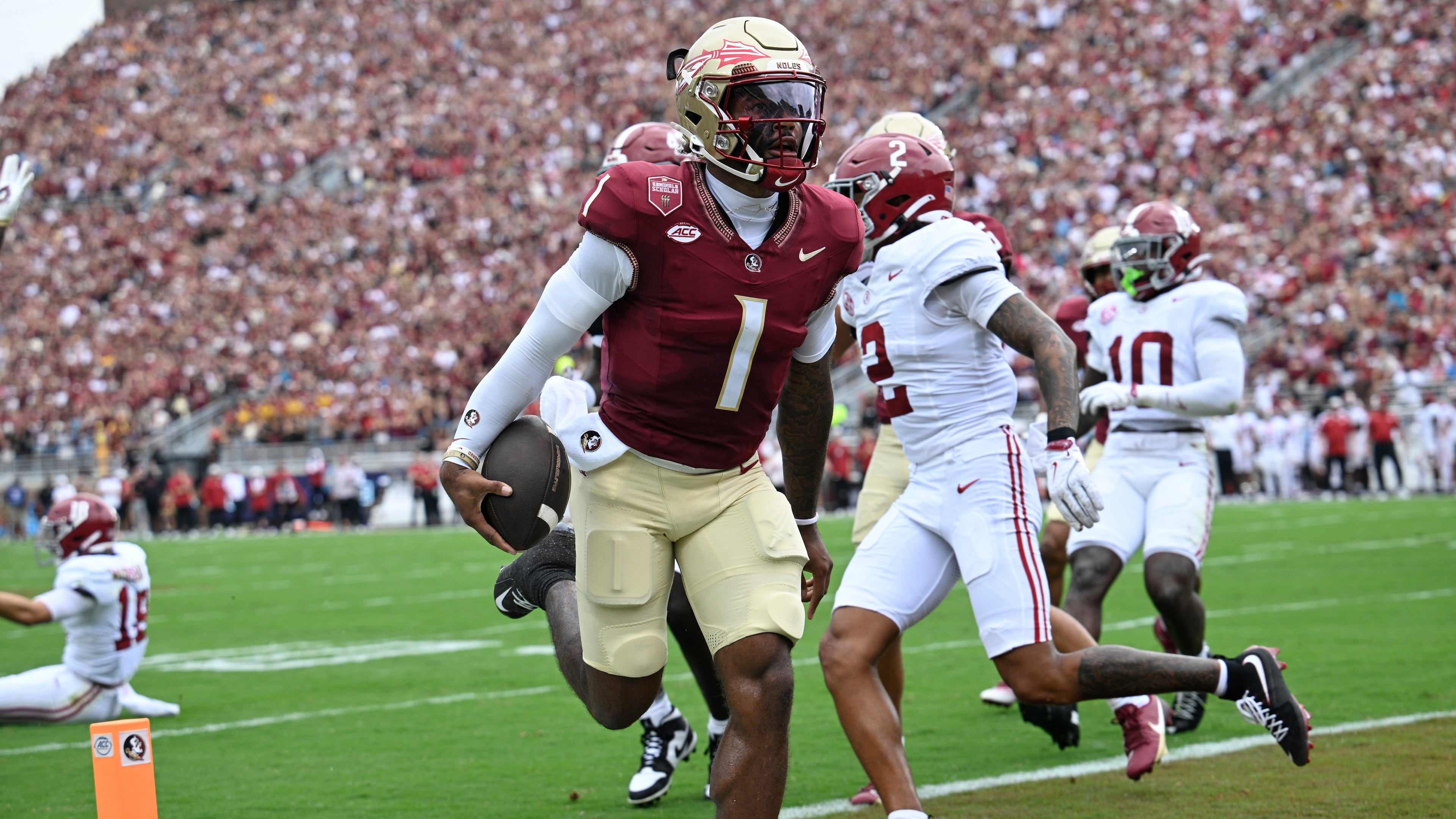 FILE - Florida State quarterback Tommy Castellanos (1) rushes for a touchdown against Alabama during the first half of an NCAA college football game, Saturday, Aug. 30, 2025, in Tallahassee, Fla. (AP Photo/Phelan M. Ebenhack,File)