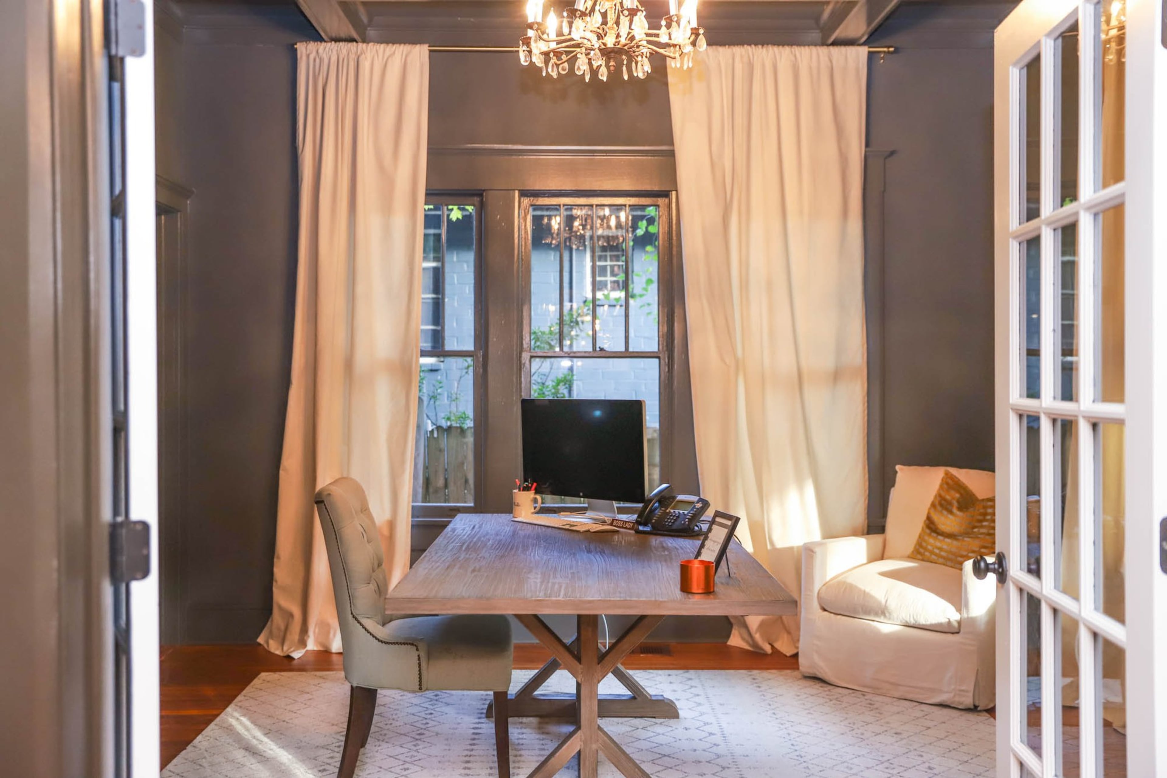 Leah Matthews’ home office is warm and minimalist, with a desk from Wayfair and a chair from World Market. Both Leah and her husband Todd Matthews work from home — he as a technology director, she as the owner of Studio Go and Studio To Go. Text by Shannon Dominy. Photo by Reynolds Rogers.