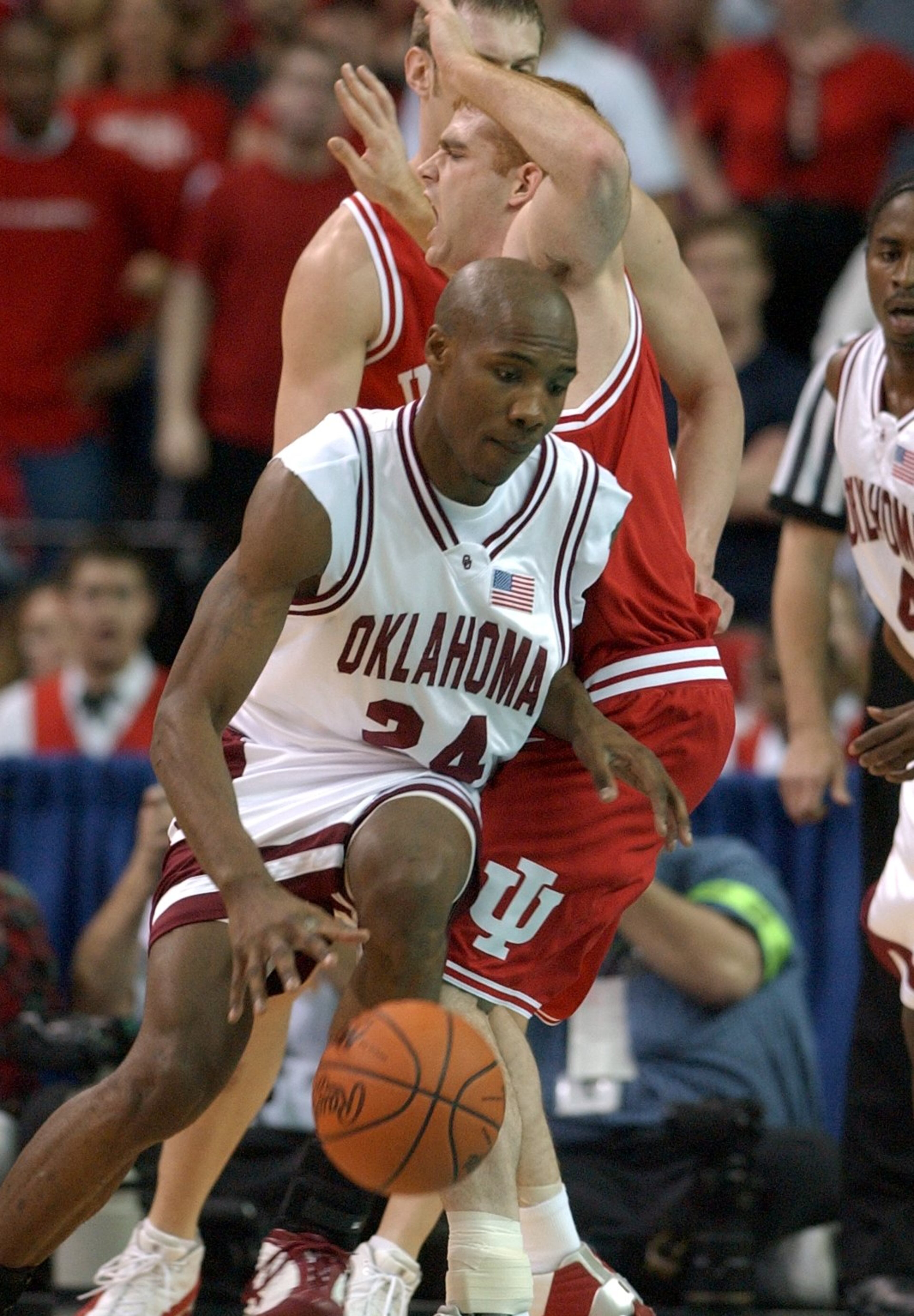 Oklahoma University's Daryan Selvy tries to drive through Indiana University's Tom Coverdale early in Game 1 of the NCAA Men's Final Four, Indiana vs. Oklahoma, at the Georgia Dome in Atlanta.