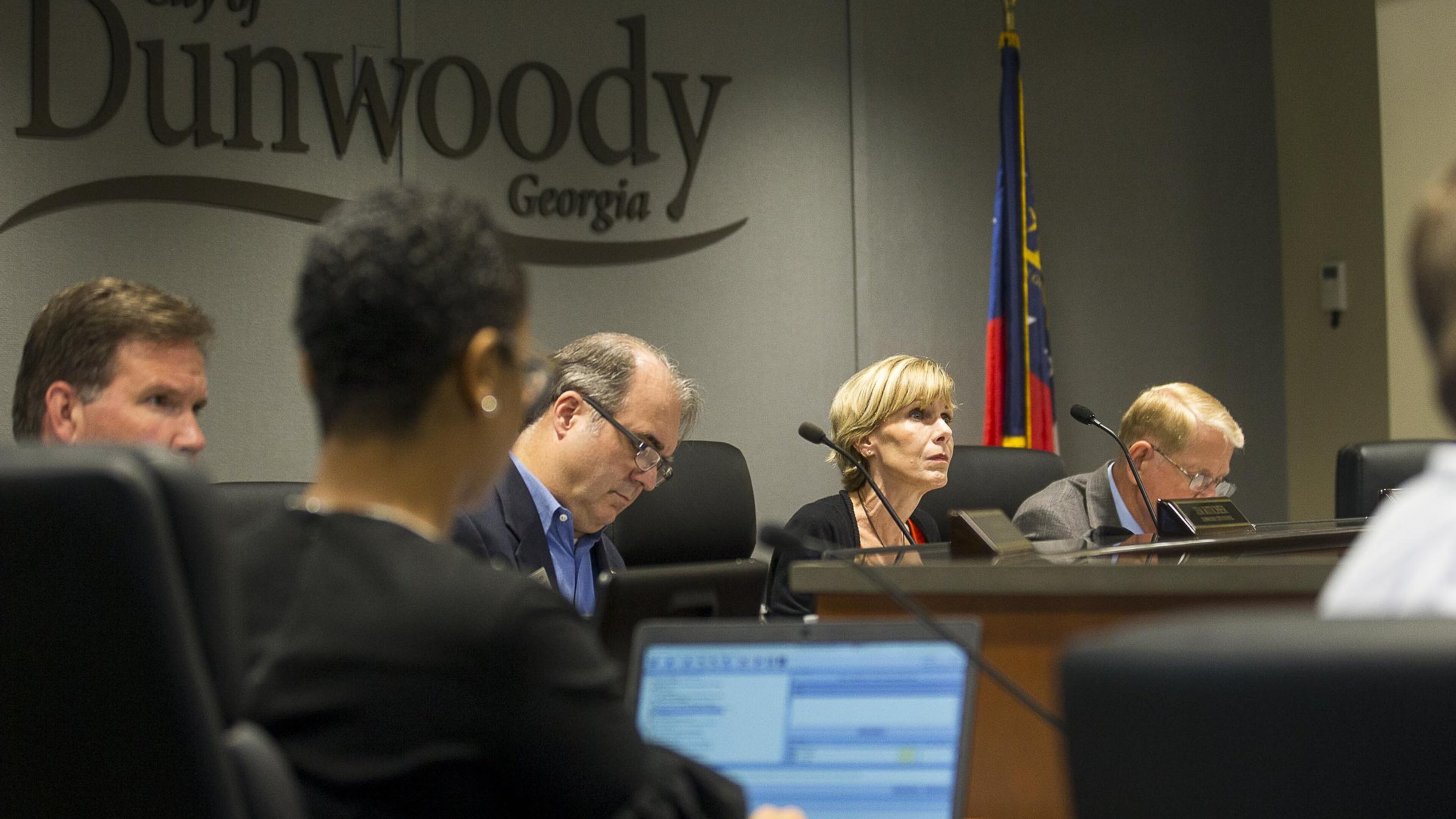 Members of the Dunwoody City Council listen to citizens during a meeting Monday. (Alyssa Pointer/alyssa.pointer@ajc.com)