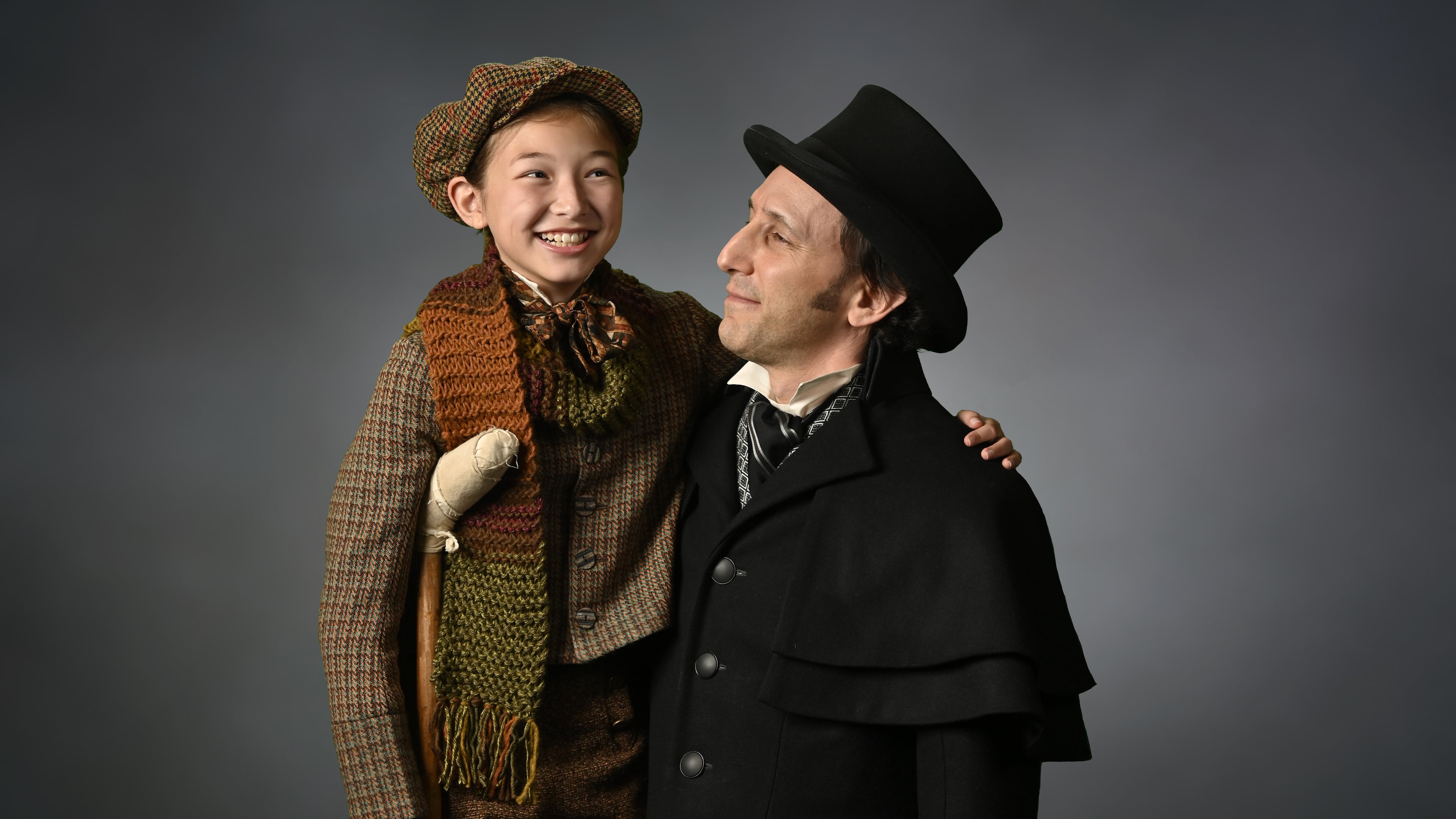 Chloe Gia Bremer (left) as Tiny Tim and Andrew Benator as Ebeneezer Scrooge are part of a new adaptation of "A Christmas Carol" at the Alliance Theatre. Photo: courtesy the Alliance Theatre