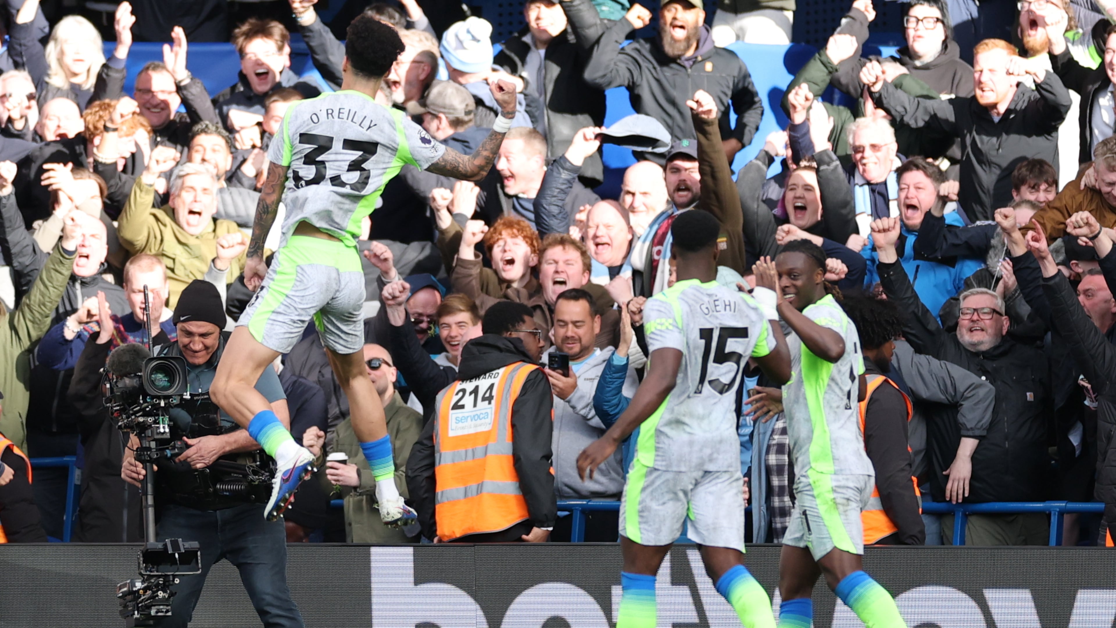 Manchester City's Nico O'Reilly celebrates after scoring during the Premier League soccer match between Chelsea and Manchester City in London, Sunday, April 12, 2026. (AP Photo/Ian Walton)
