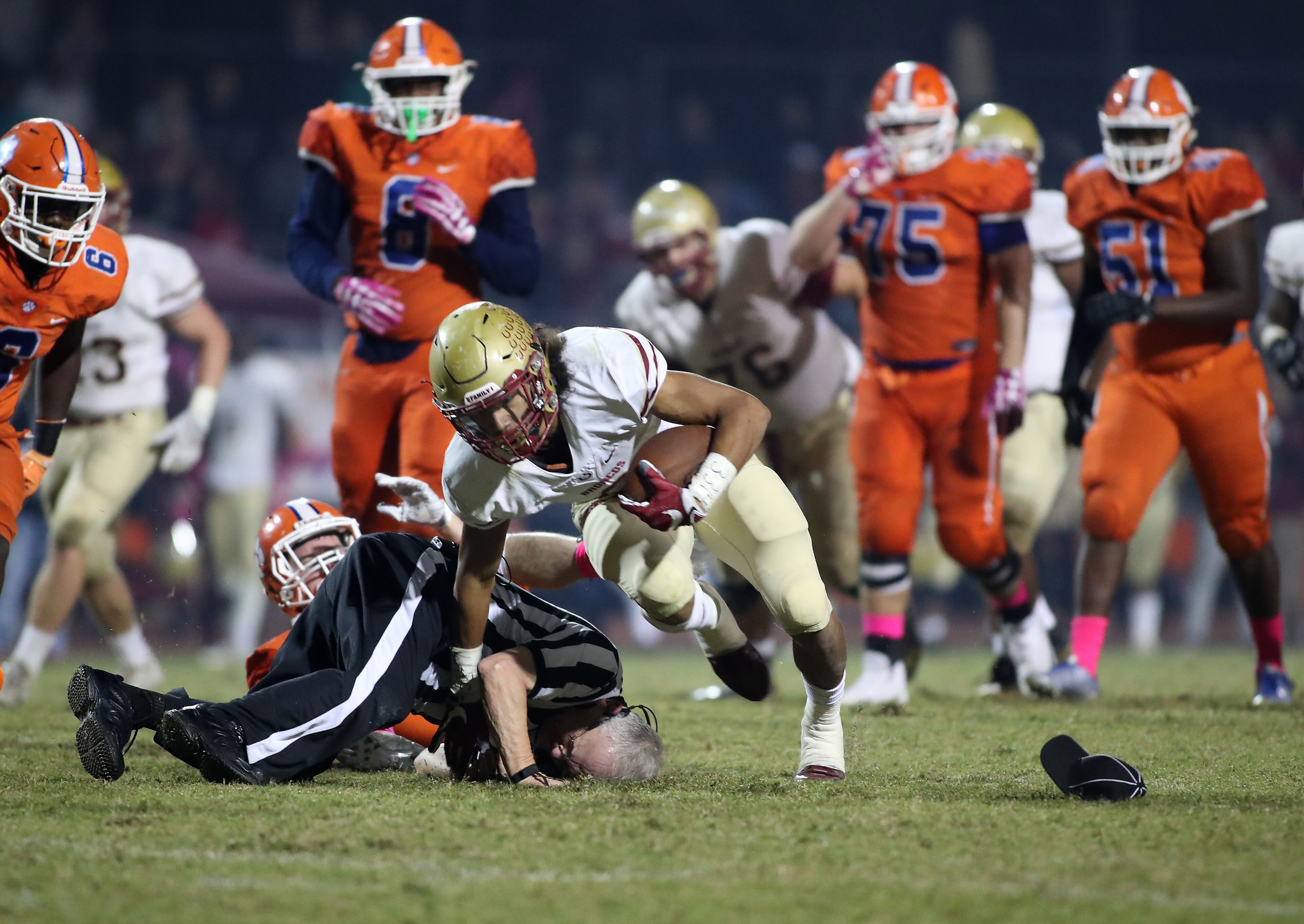 October 20, 2017 - Lilburn, Ga: Brookwood wide receiver Matthew Hill (2) stays upright after colliding with an official during a run in the second half of their game against Parkview at Parkview High School Friday, October 20, 2017, in Lilburn, Ga.. Brookwood won 30-27. PHOTO / JASON GETZ