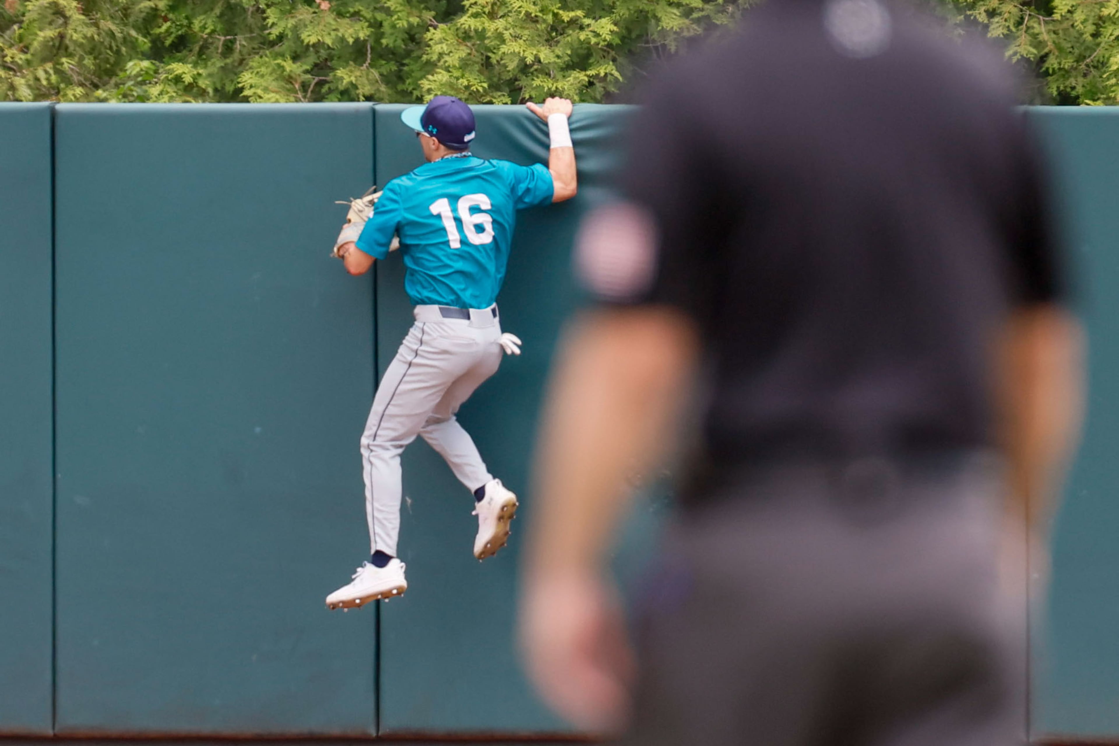 UNC Wilmington’s left fielder Brock Wills hangs from the wall as he watches the two-run home run by Georgia Tech’s Mike Becchetti during the fourth inning at Foley Field in the NCAA Tournament Regional on Sunday, June 2, 2024, in Athens.
(Miguel Martinez / AJC)
