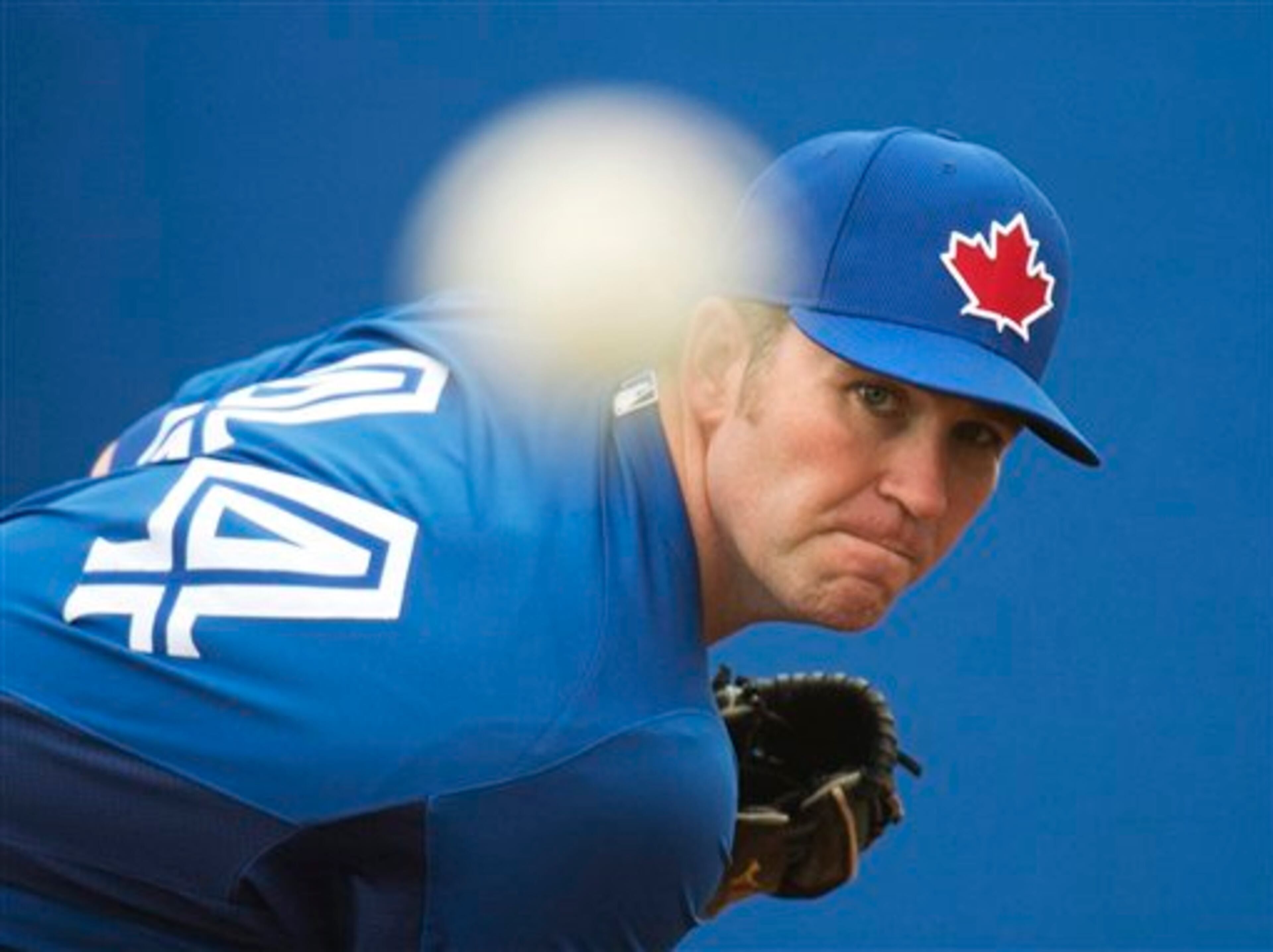 Toronto Blue Jays pitcher Casey Janssen throws a pitch in the bullpen during baseball spring training in Dunedin, Fla., on Wednesday, Feb. 20, 2013. (AP Photo/The Canadian Press, Nathan Denette)