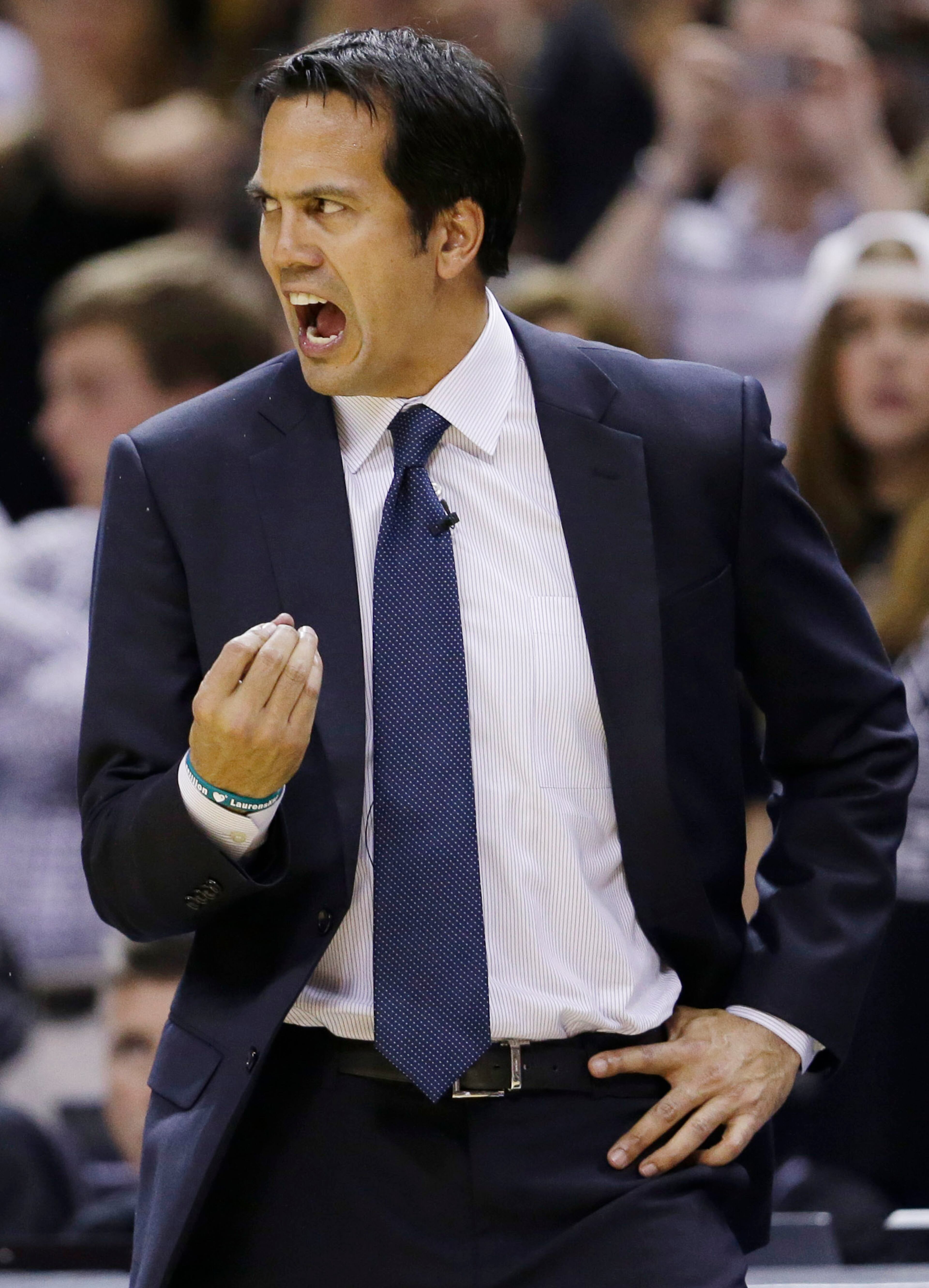 Miami Heat head coach Erik Spoelstra shouts on the sideline against the San Antonio Spurs during the second half in Game 5 of the NBA basketball finals on Sunday, June 15, 2014, in San Antonio. (AP Photo/David J. Phillip)