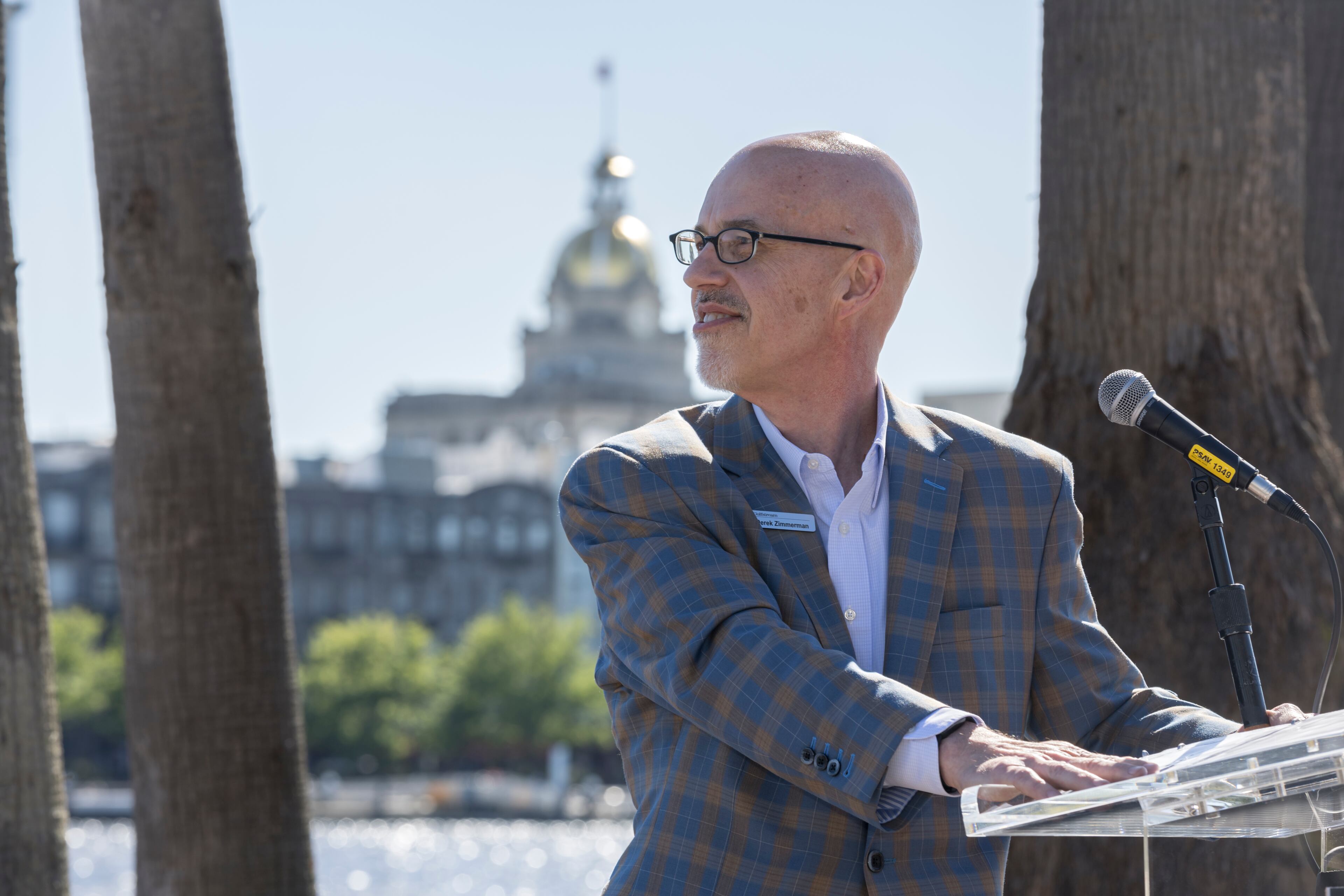 SAVANNAH, GA - APRIL 04, 2024: Derek Zimmerman, President of Gulfstream Customer Support, waits for two of the companyÕs newest planes to fly over during an event to celebrate the newly certified Gulfstream Aerospace Corporation G700, Thursday, April 4, 2024, in Savannah, Ga. The Savannah-based aircraft manufacturer gets long-awaited FAA type certificate for ultra-luxury corporate jet. (AJC Photo/Stephen B. Morton)